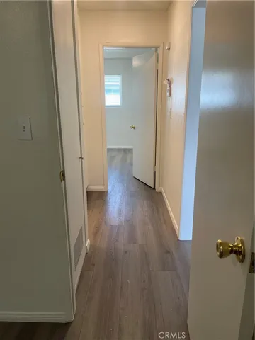 a bathroom with a toilet sink vanity and mirror