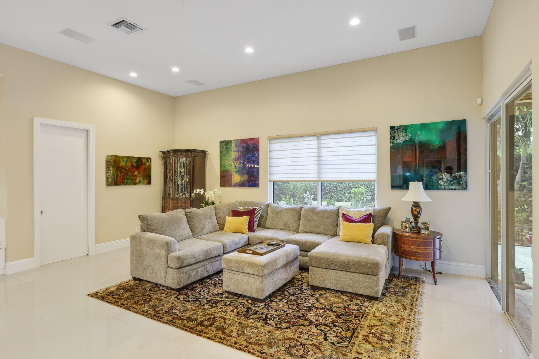 7039 Mandarin Drive Boca Raton, FL 33433 - Photo 12 of 52 a living room with furniture and a large window