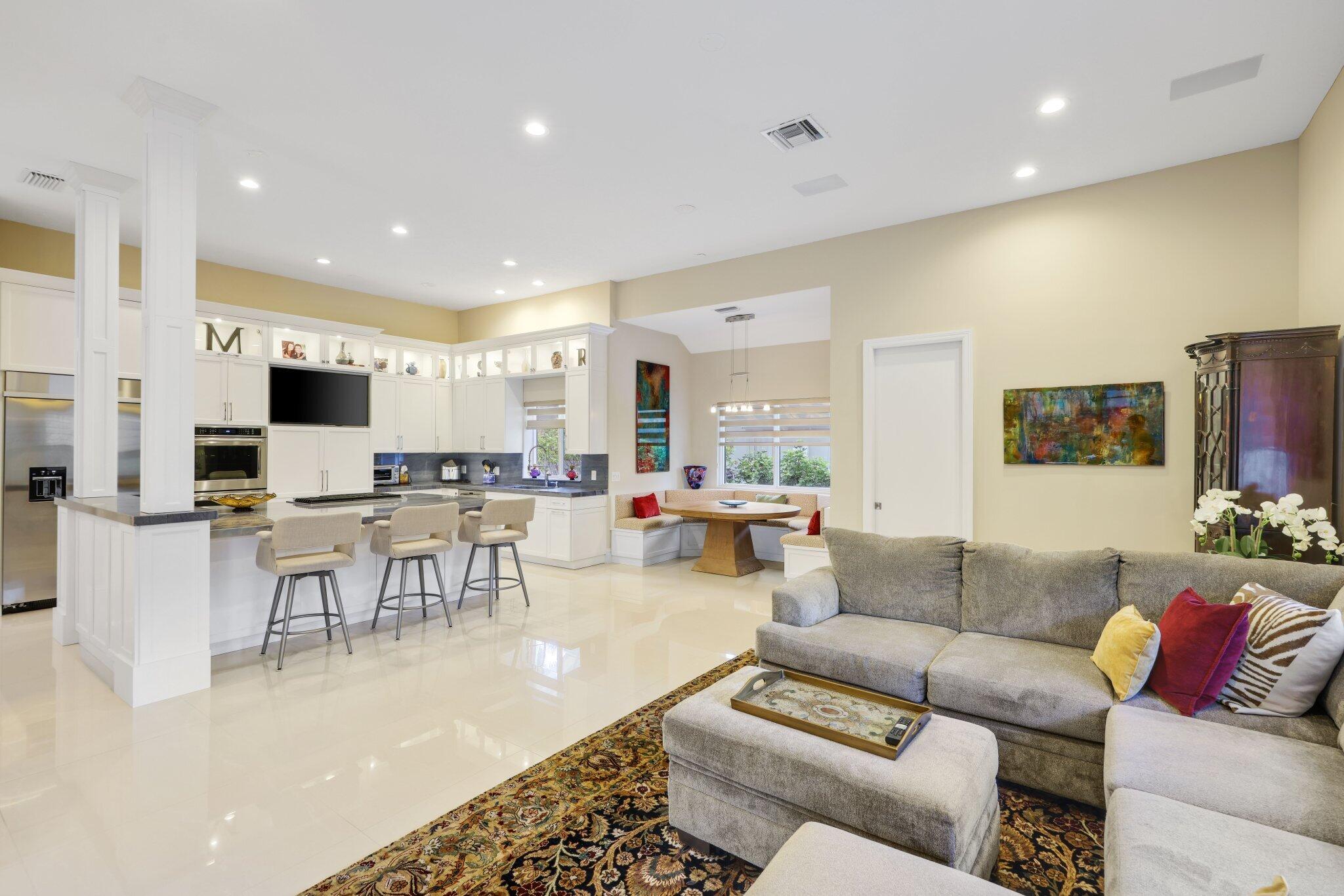 7039 Mandarin Drive Boca Raton, FL 33433 - Photo 13 of 52 a living room with furniture and a flat screen tv
