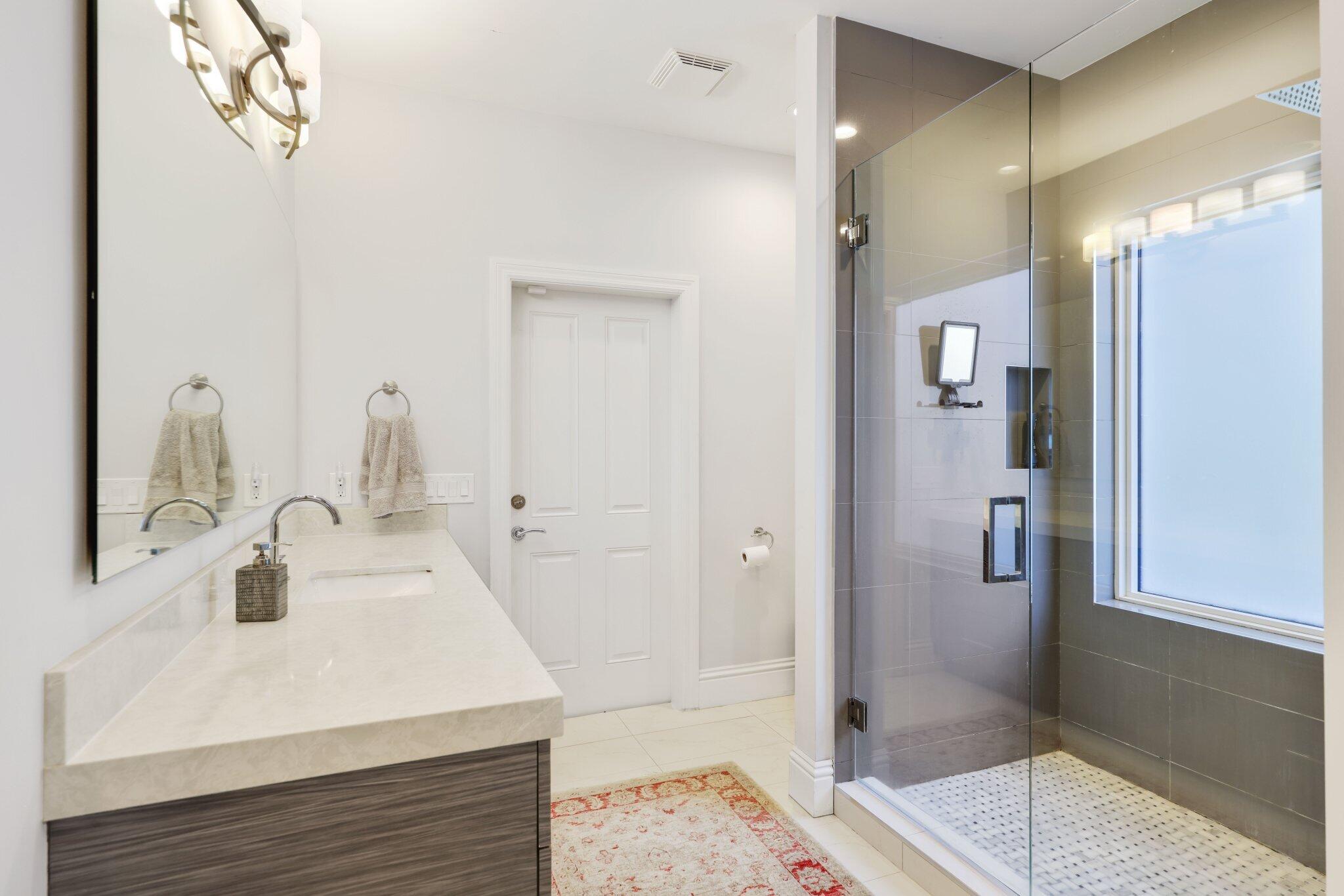 7039 Mandarin Drive Boca Raton, FL 33433 - Photo 20 of 52 a bathroom with a sink and a mirror