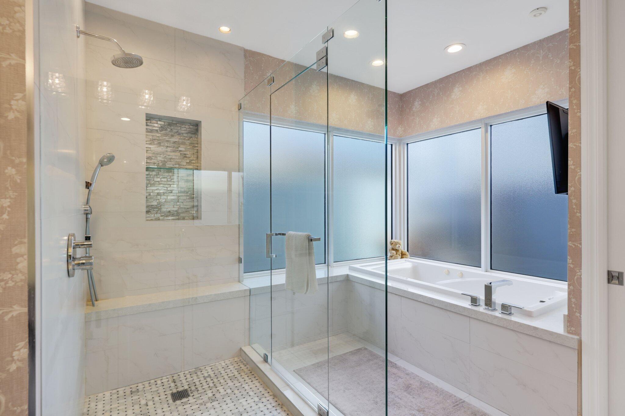 7039 Mandarin Drive Boca Raton, FL 33433 - Photo 23 of 52 a bathroom with a glass shower door and a sink