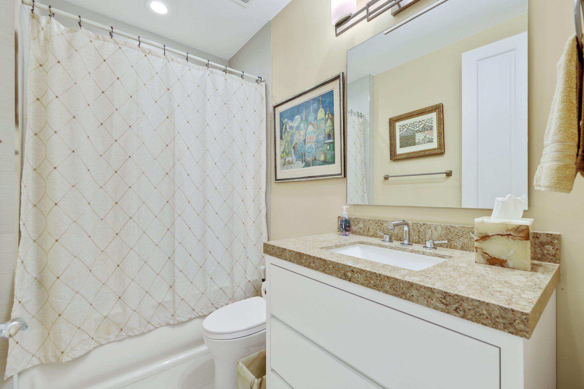 7039 Mandarin Drive Boca Raton, FL 33433 - Photo 27 of 52 a bathroom with a granite countertop sink mirror vanity and toilet