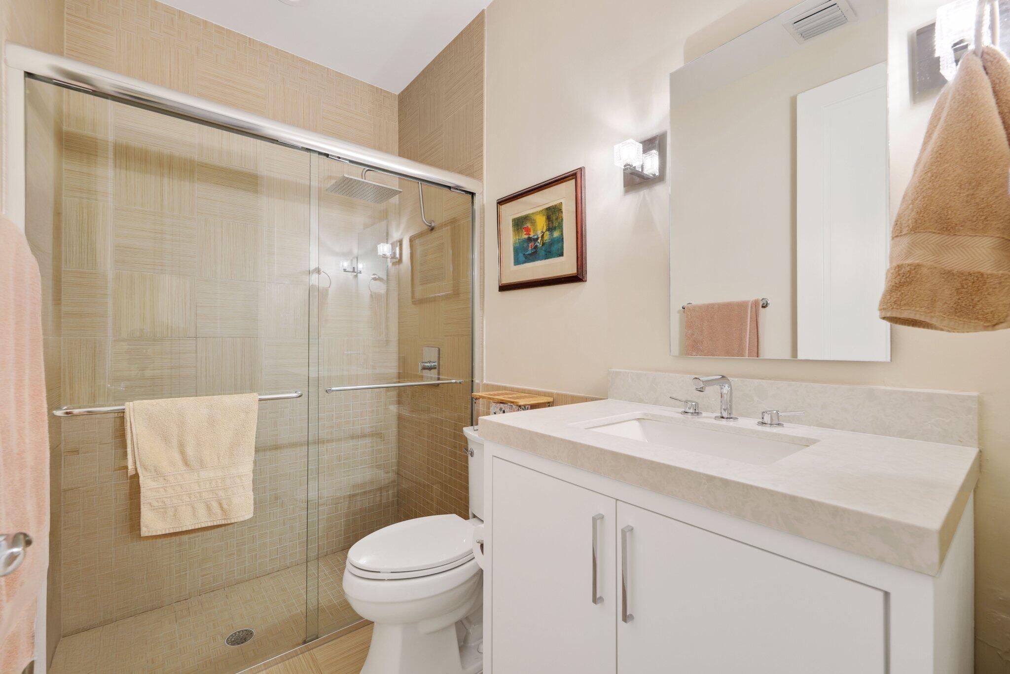 7039 Mandarin Drive Boca Raton, FL 33433 - Photo 29 of 52 a bathroom with a sink toilet and shower