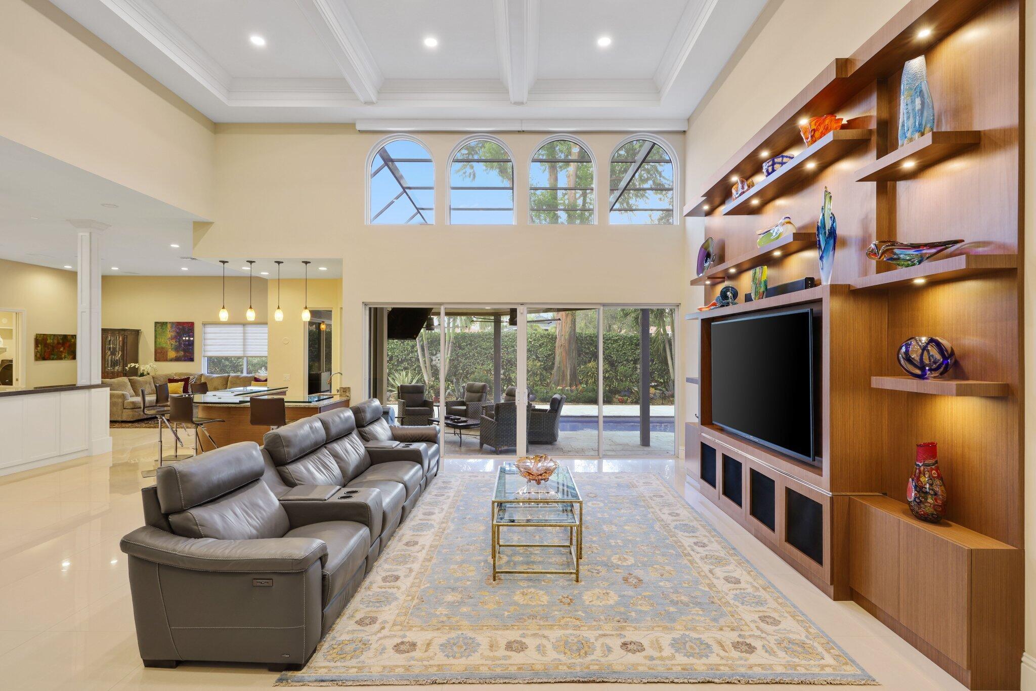 7039 Mandarin Drive Boca Raton, FL 33433 - Photo 7 of 52 a living room with fireplace furniture and a flat screen tv