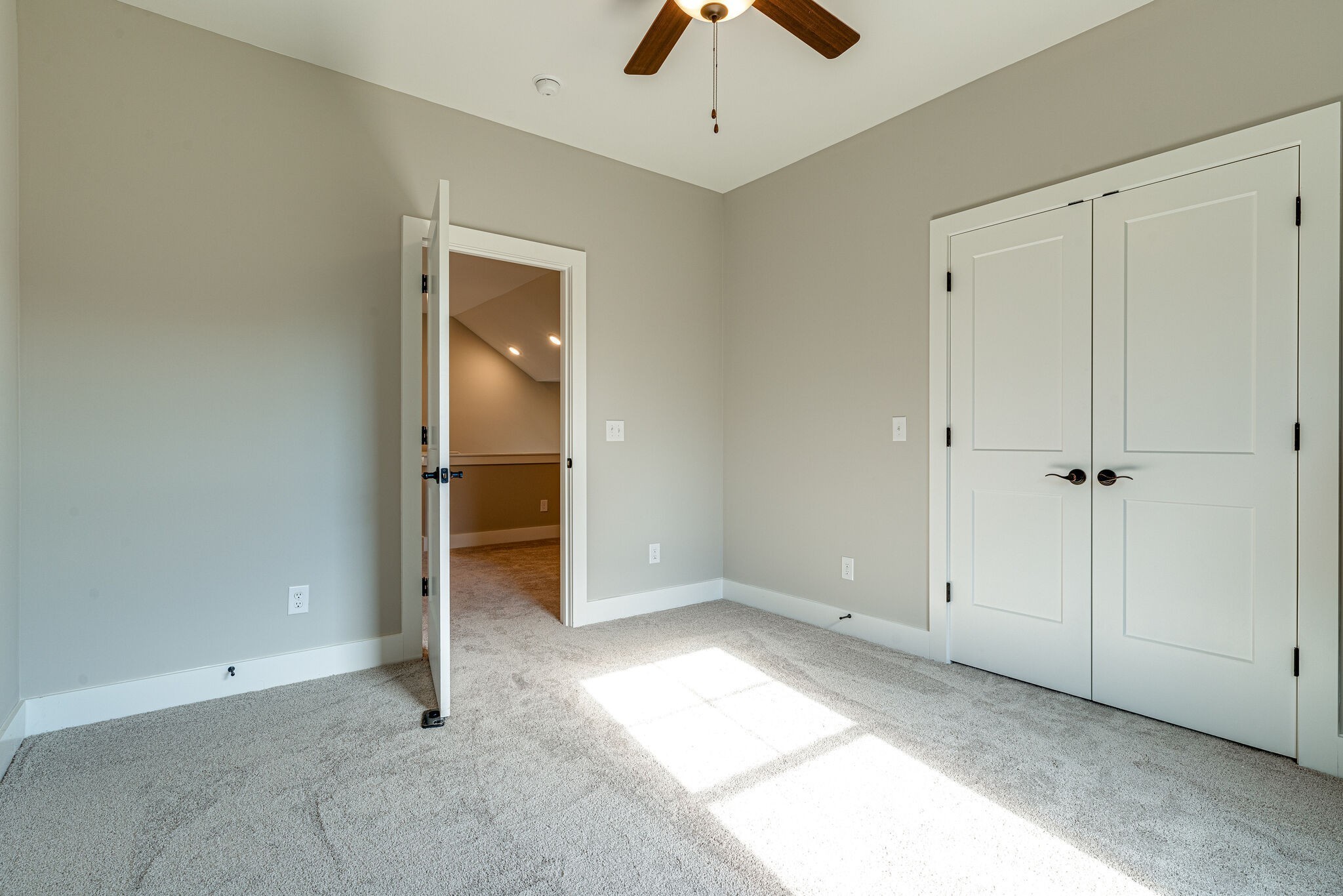 1020 Sycamore Ridge West, Unit 41 Burns, TN 37029 - Photo 54 of 60 an empty room with closet and a chandelier fan