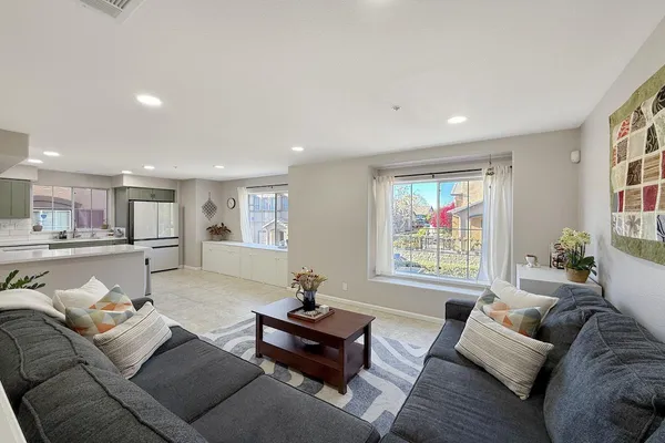 a living room with furniture and a large window