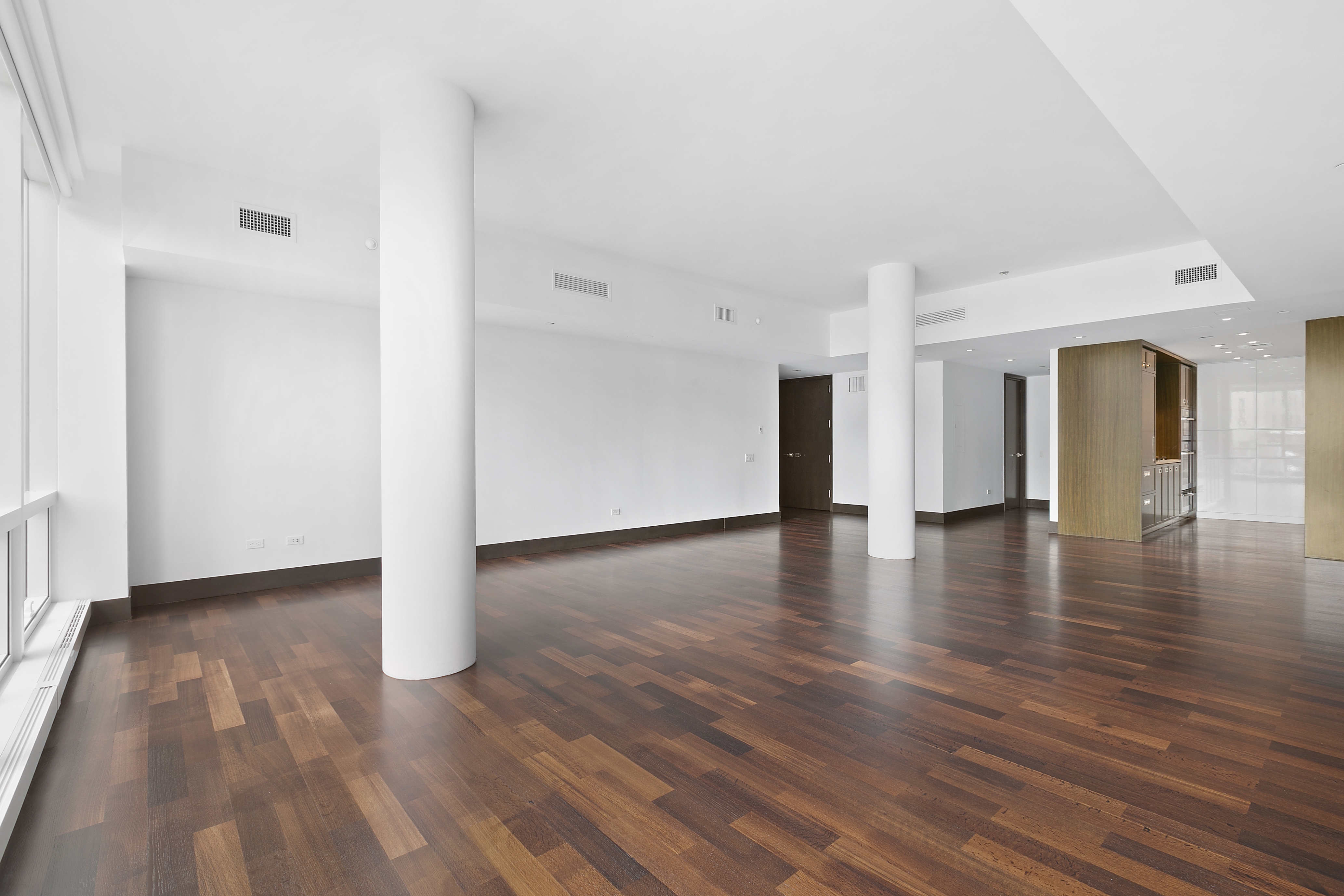 151 East 85th Street, Unit 6B Manhattan, NY 10028 - Photo 8 of 10 a view of a livingroom with wooden floor