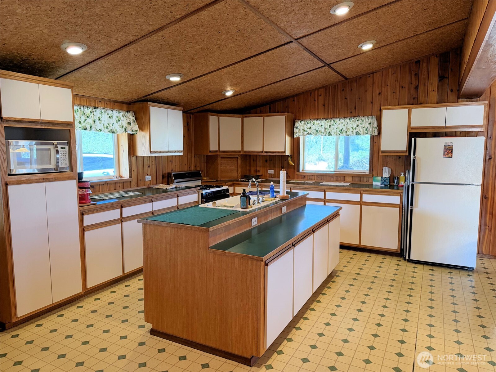 41238 Sterling Valley Road North Lincoln, WA 99147 - Photo 5 of 39 a kitchen with stainless steel appliances granite countertop a sink stove and refrigerator