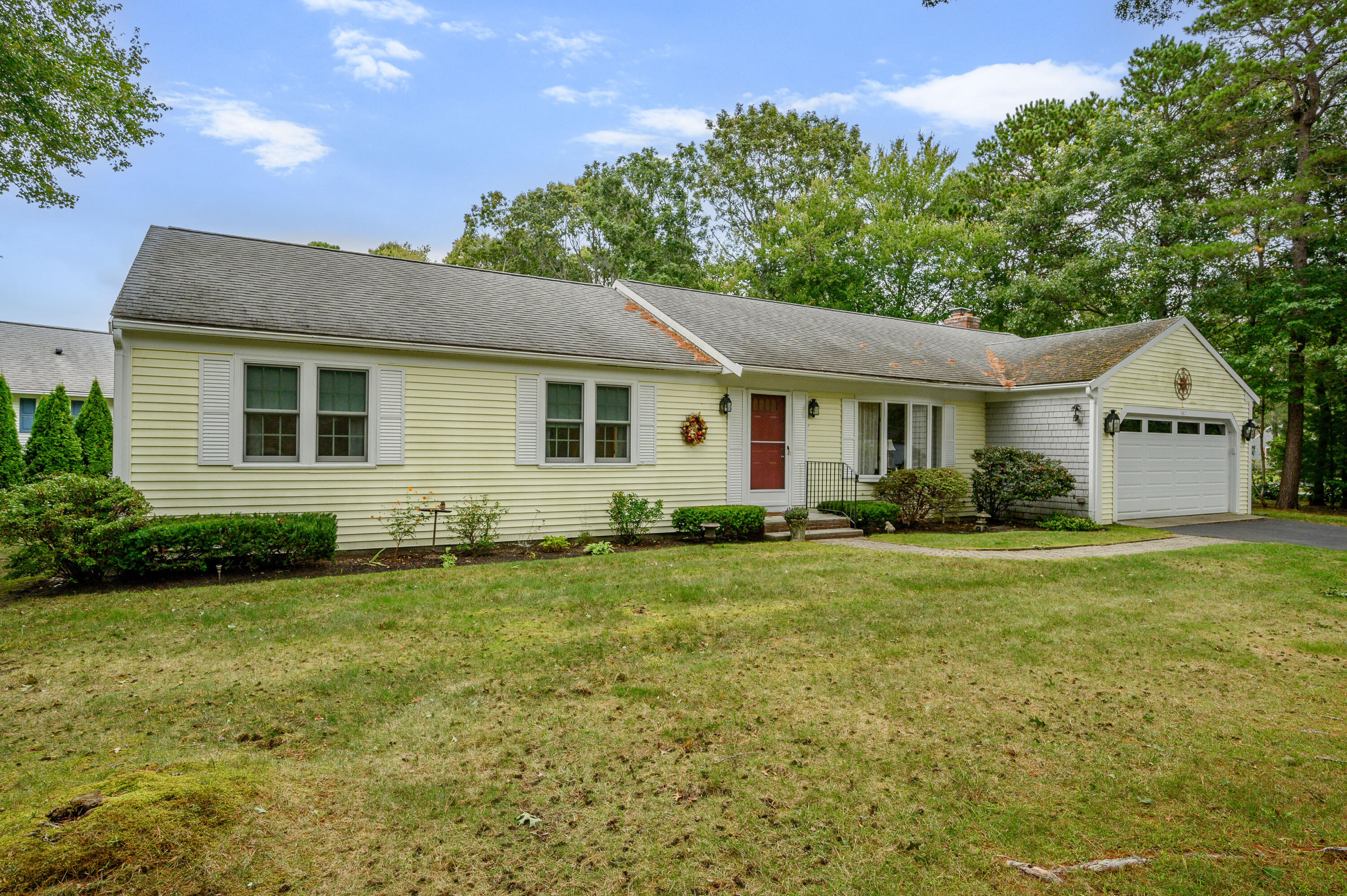 167 James Otis Road Centerville, MA 02632 - Photo 1 of 36 a front view of a house with a garden