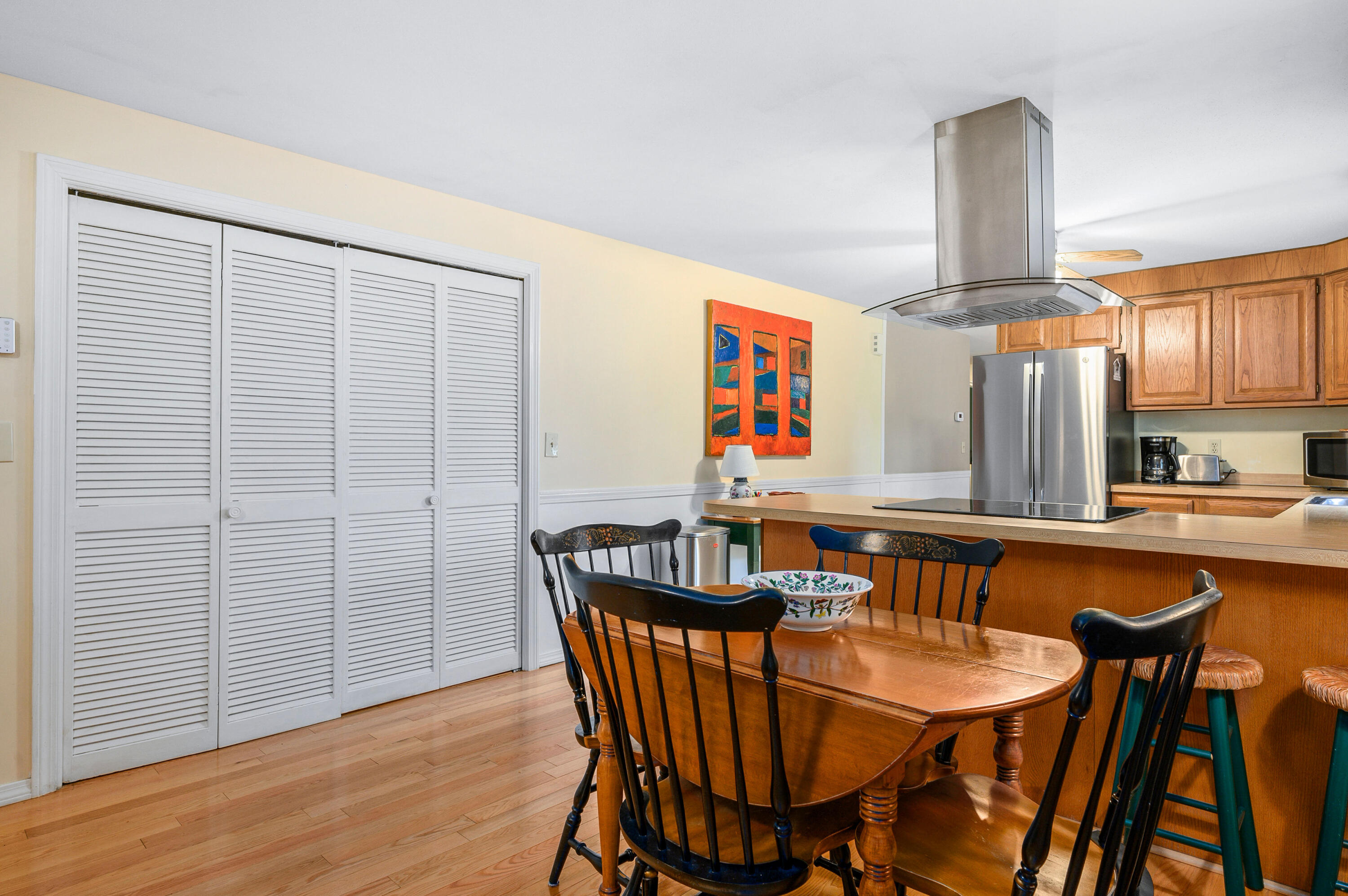167 James Otis Road Centerville, MA 02632 - Photo 13 of 36 a view of a dining room with furniture window and wooden floor