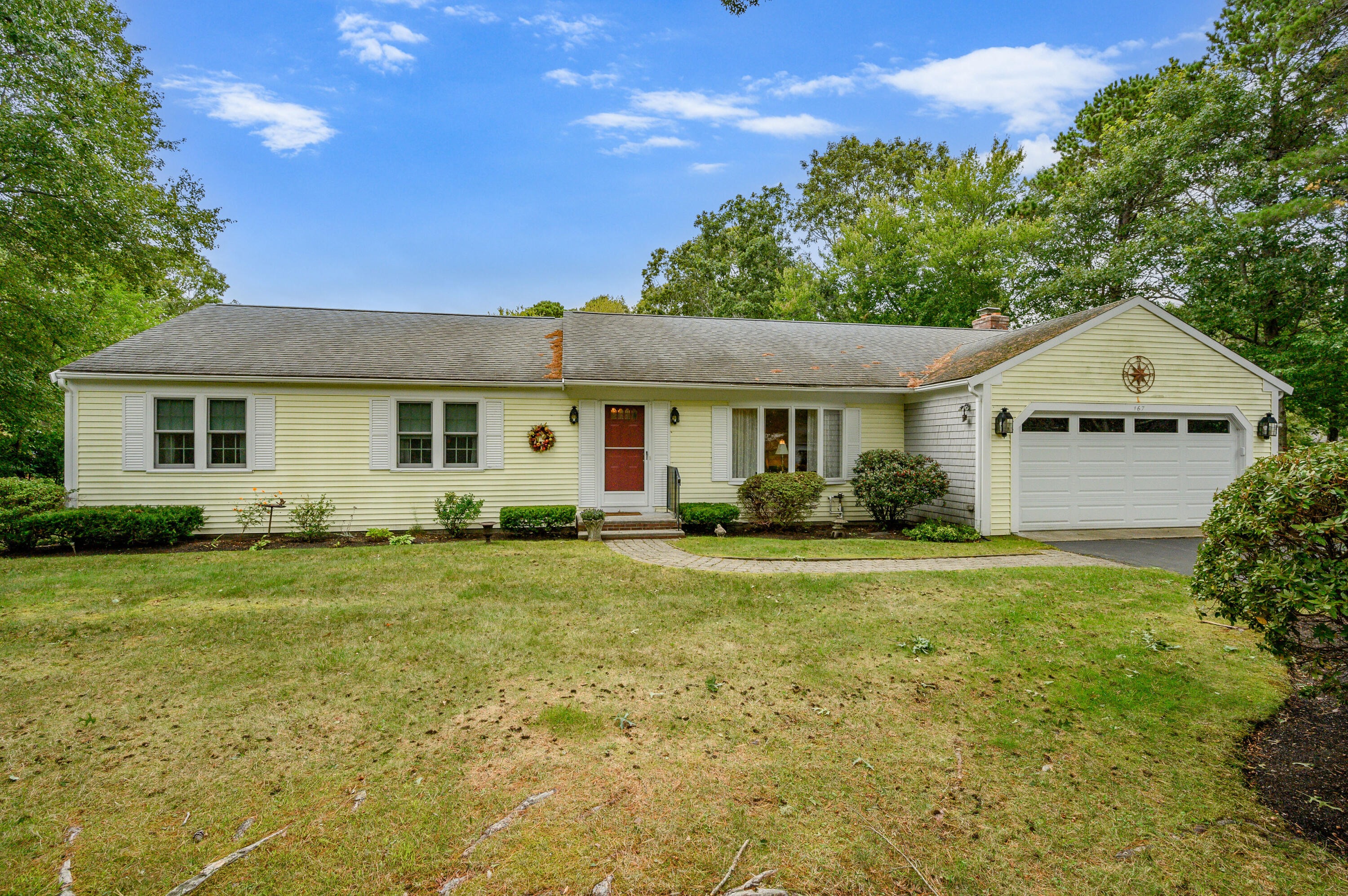 167 James Otis Road Centerville, MA 02632 - Photo 2 of 36 a front view of a house with a yard