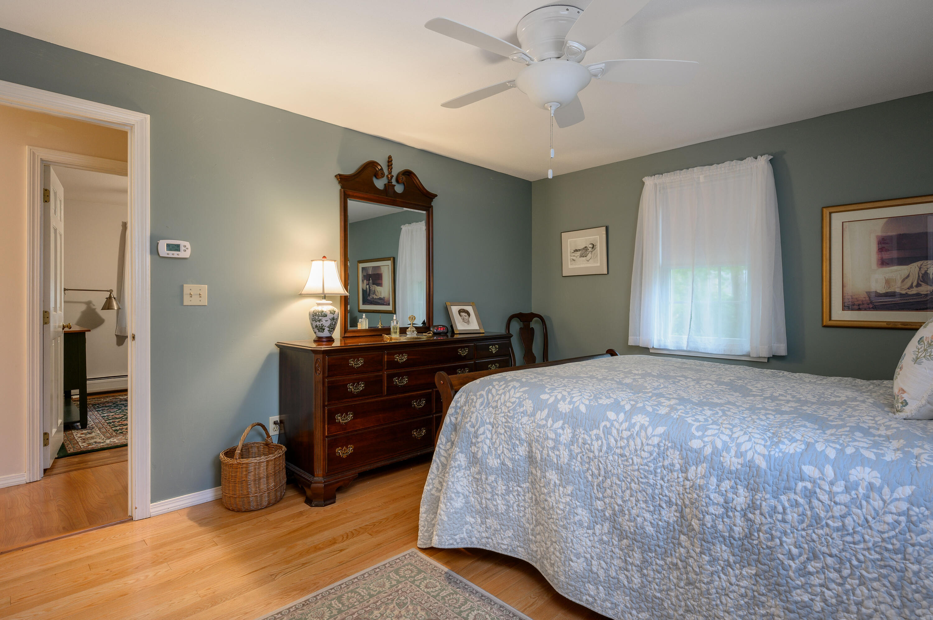 167 James Otis Road Centerville, MA 02632 - Photo 28 of 36 a bedroom with a bed and a chandelier
