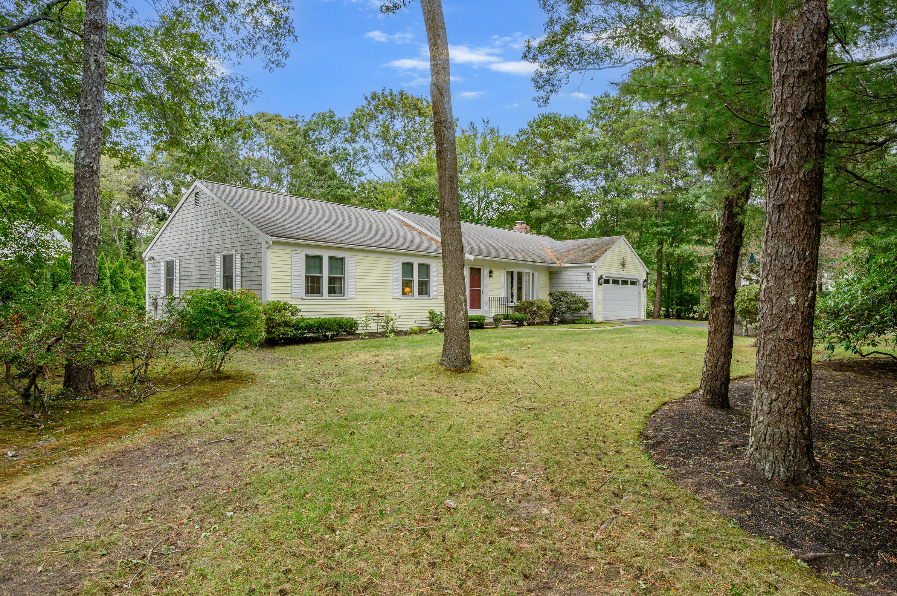 167 James Otis Road Centerville, MA 02632 - Photo 3 of 36 a front view of a house with garden