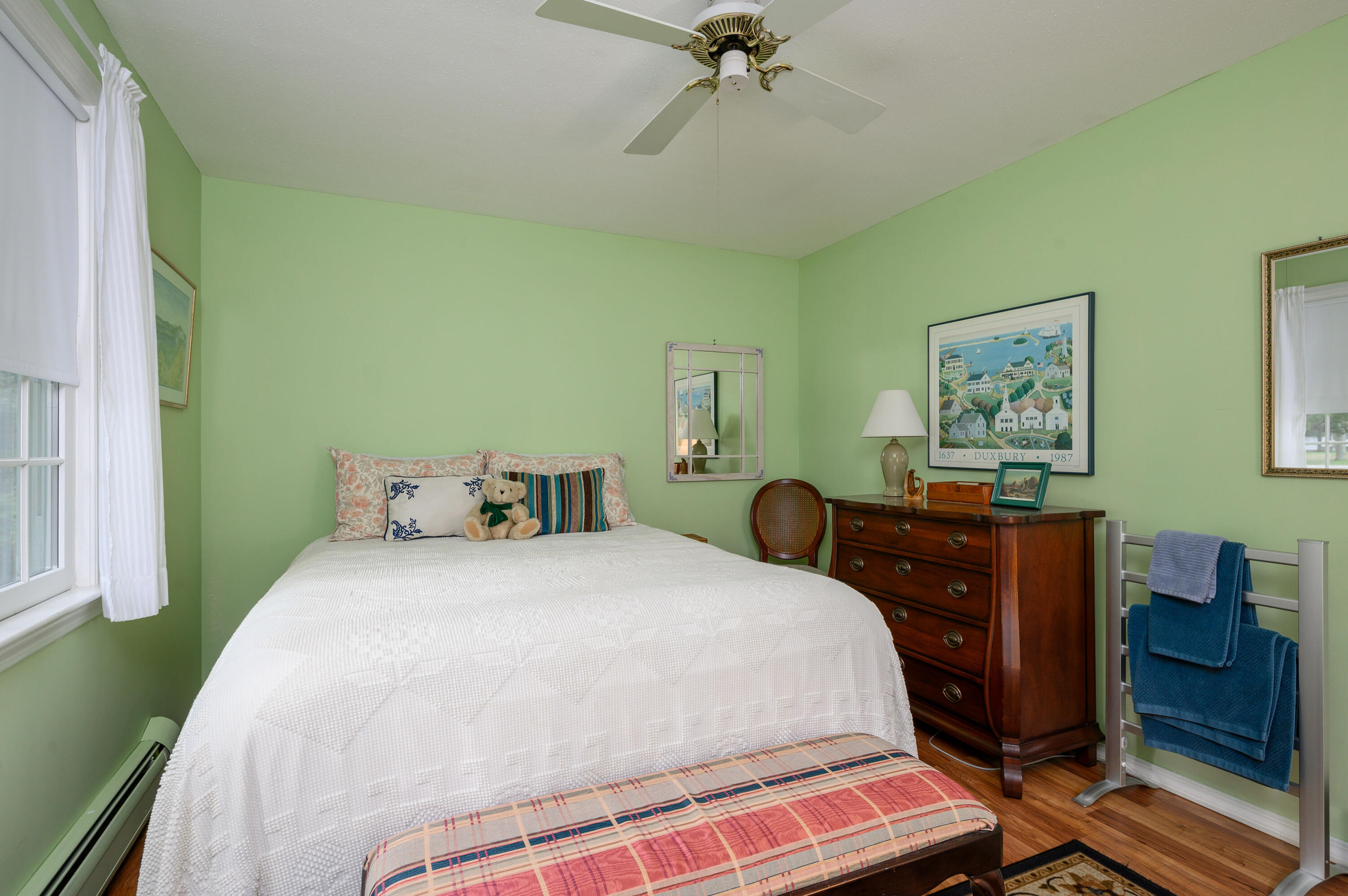 167 James Otis Road Centerville, MA 02632 - Photo 32 of 36 a bedroom with a bed and wooden floor