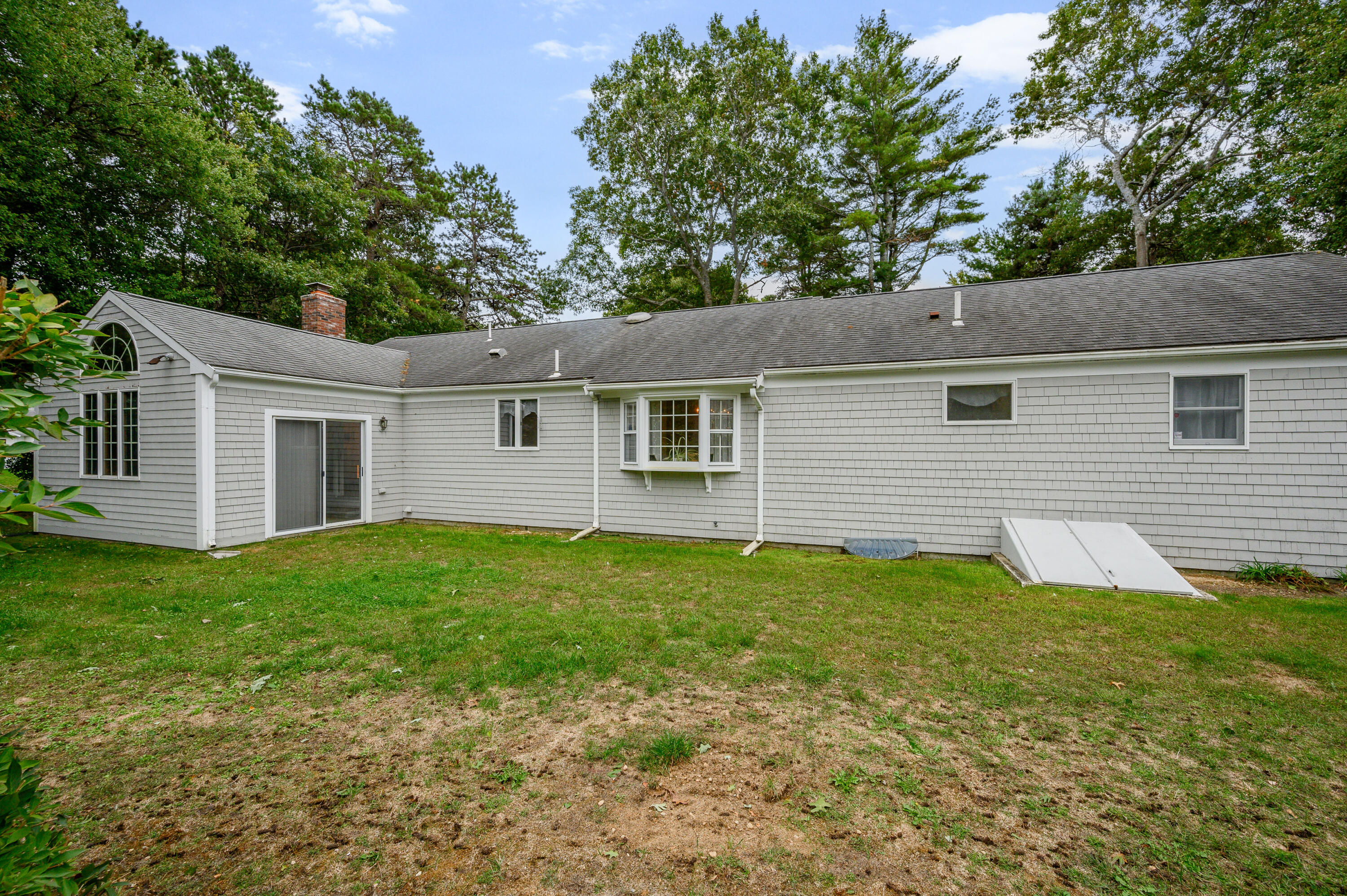 167 James Otis Road Centerville, MA 02632 - Photo 5 of 36 a view of a backyard with a garden