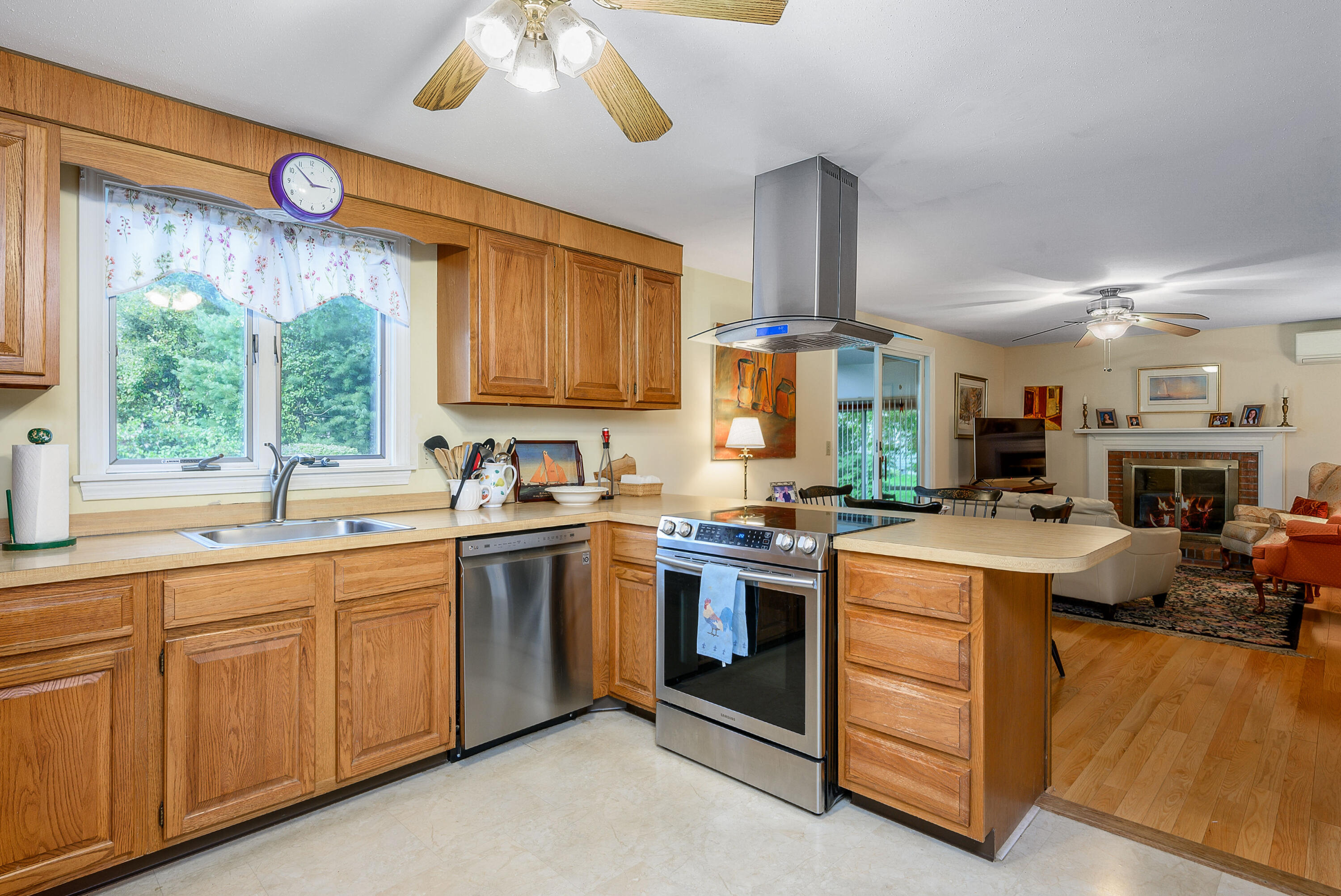 167 James Otis Road Centerville, MA 02632 - Photo 8 of 36 a kitchen with a stove window and cabinets