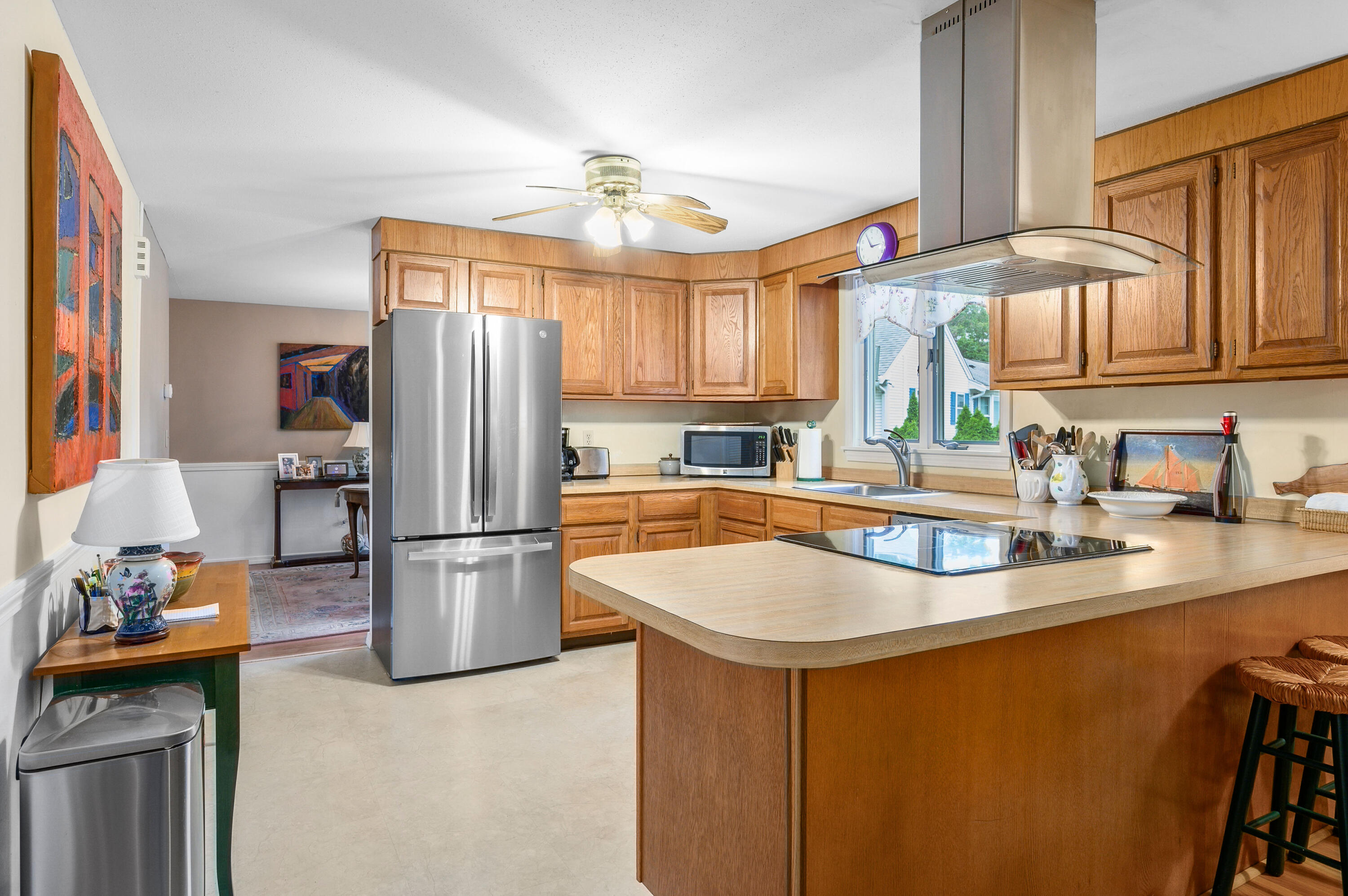 167 James Otis Road Centerville, MA 02632 - Photo 10 of 36 a kitchen with refrigerator and cabinets