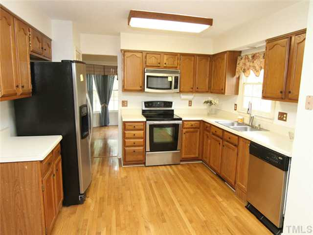 809 Carpenter Fletcher Road Durham, NC 27713 - Photo 2 of 14 The kitchen features stainless steel appliances and provides easy access to the dining room. The refrigerator conveys with an acceptable offer. Kitchen