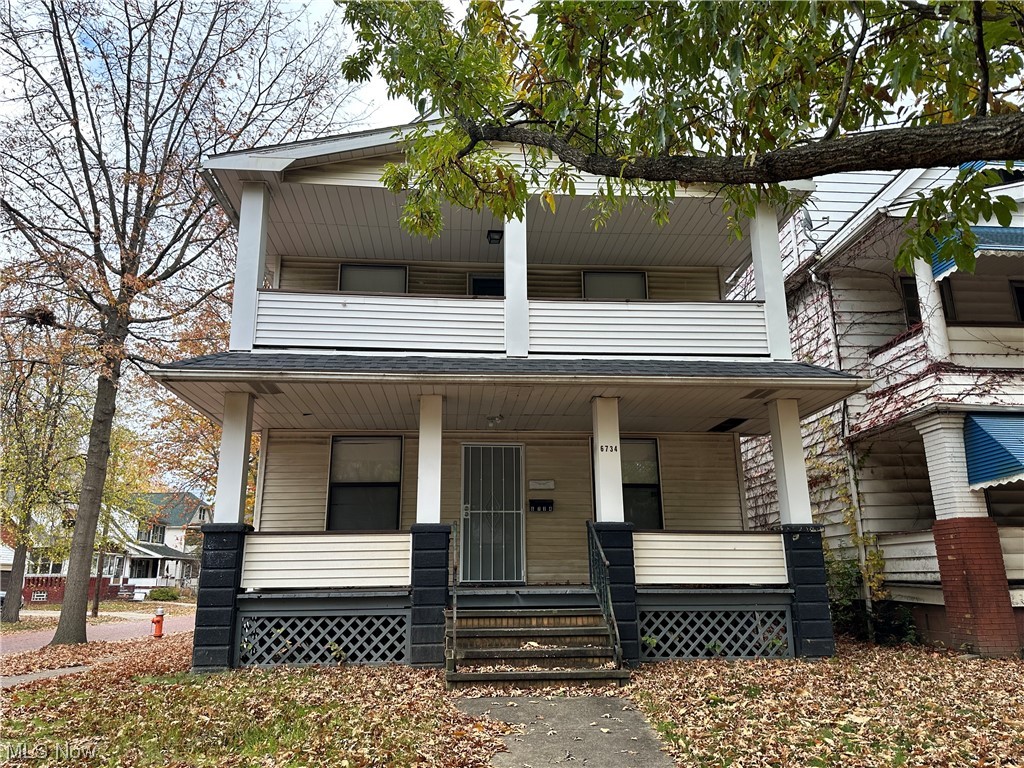 6734 Ottawa Road Cleveland, OH 44105 - Photo 25 of 31 View of front facade featuring a porch and a balcony