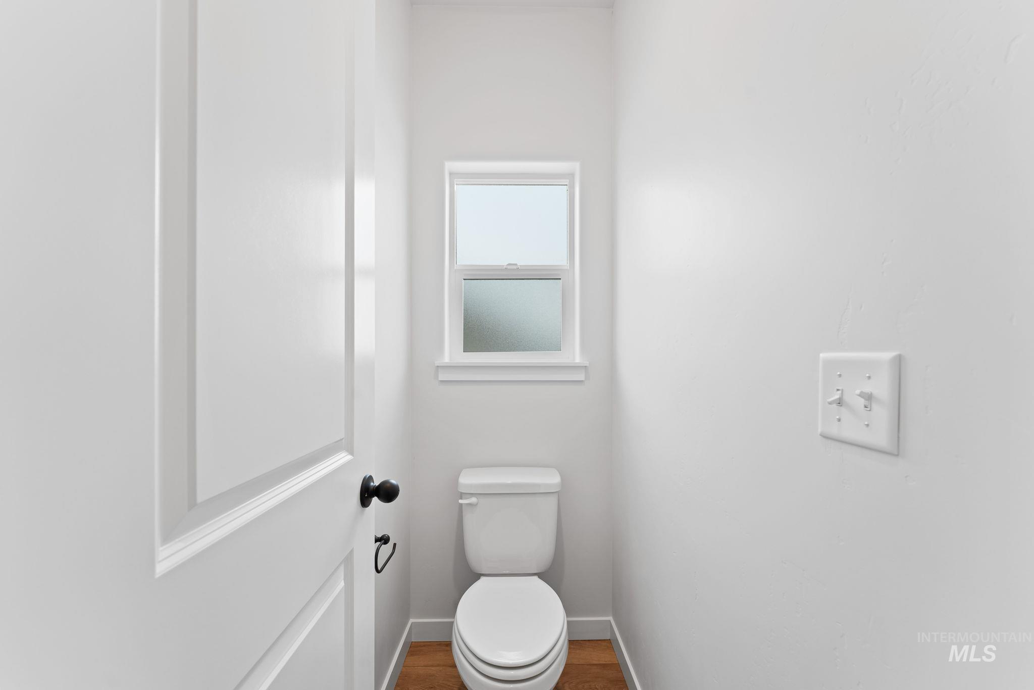 2220 Great Basin Way Burley, ID 83318 - Photo 22 of 39 Bathroom featuring toilet and wood finished floors