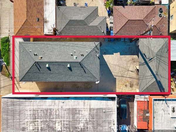 a view of a balcony with furniture and wooden floor