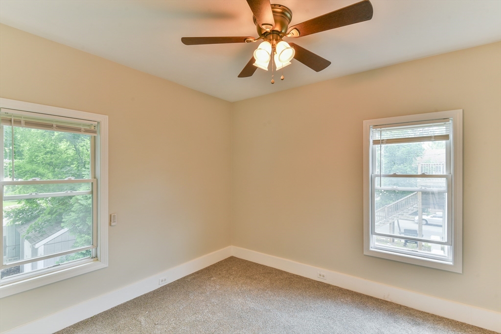 4 Agate Avenue Worcester, MA 01604 - Photo 13 of 39 an empty room with windows and fan