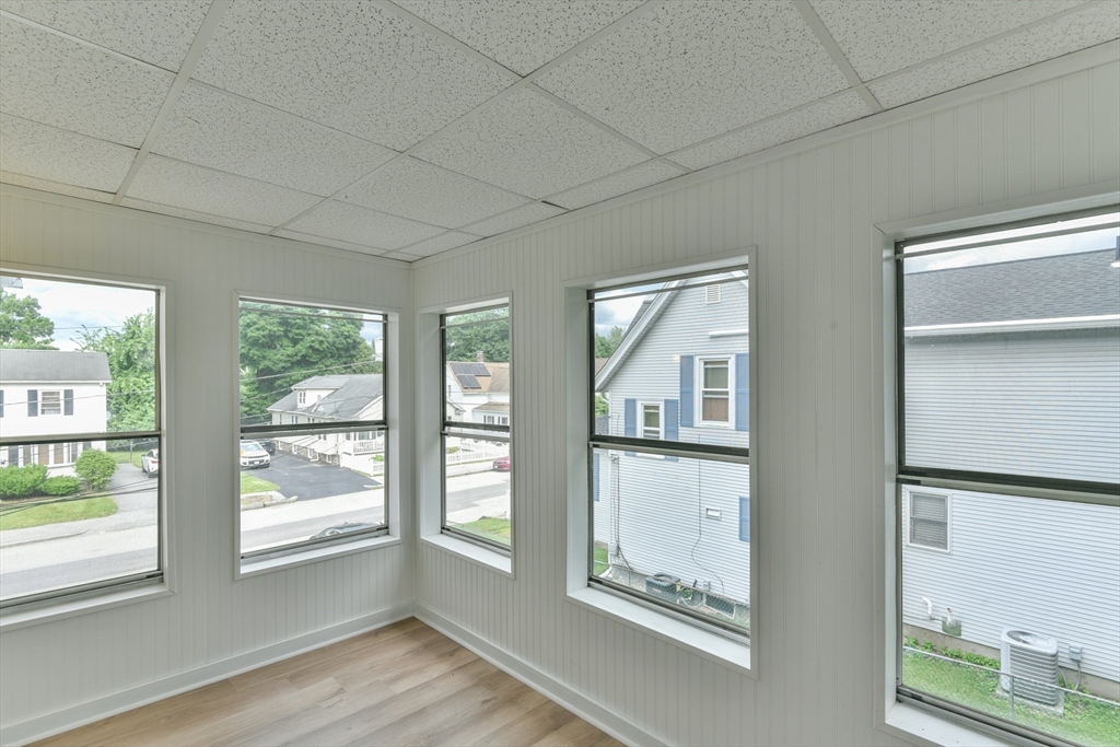 4 Agate Avenue Worcester, MA 01604 - Photo 16 of 39 a view of an empty room with wooden floor and a window