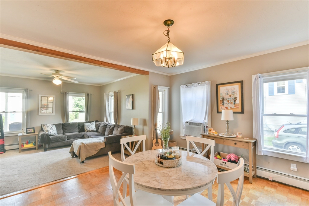 4 Agate Avenue Worcester, MA 01604 - Photo 20 of 39 a view of a dining room with furniture a chandelier and wooden floor