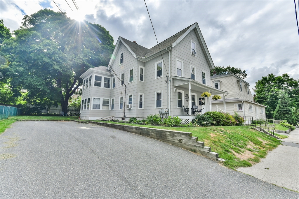 4 Agate Avenue Worcester, MA 01604 - Photo 2 of 39 a view of a big house with a big yard and large trees