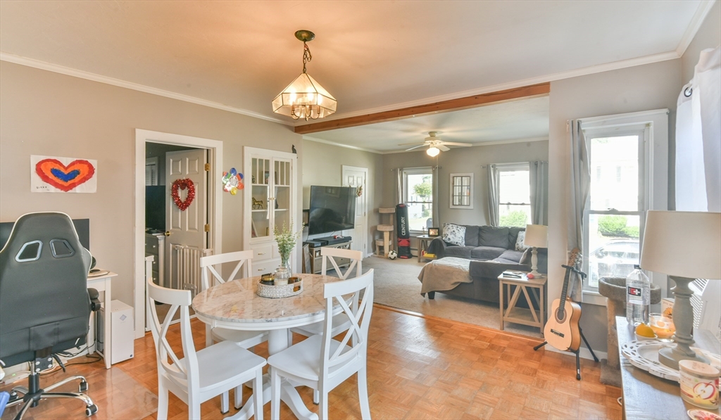 4 Agate Avenue Worcester, MA 01604 - Photo 21 of 39 a view of a dining room with furniture a chandelier and wooden floor