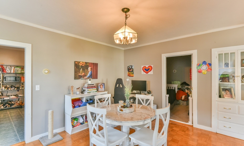 4 Agate Avenue Worcester, MA 01604 - Photo 22 of 39 a view of a dining room with furniture wooden floor and a chandelier
