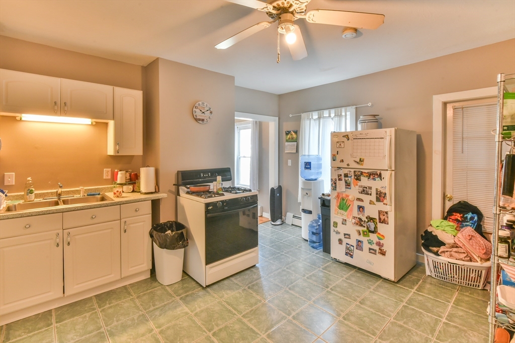 4 Agate Avenue Worcester, MA 01604 - Photo 25 of 39 a kitchen with stainless steel appliances a stove a sink and a refrigerator