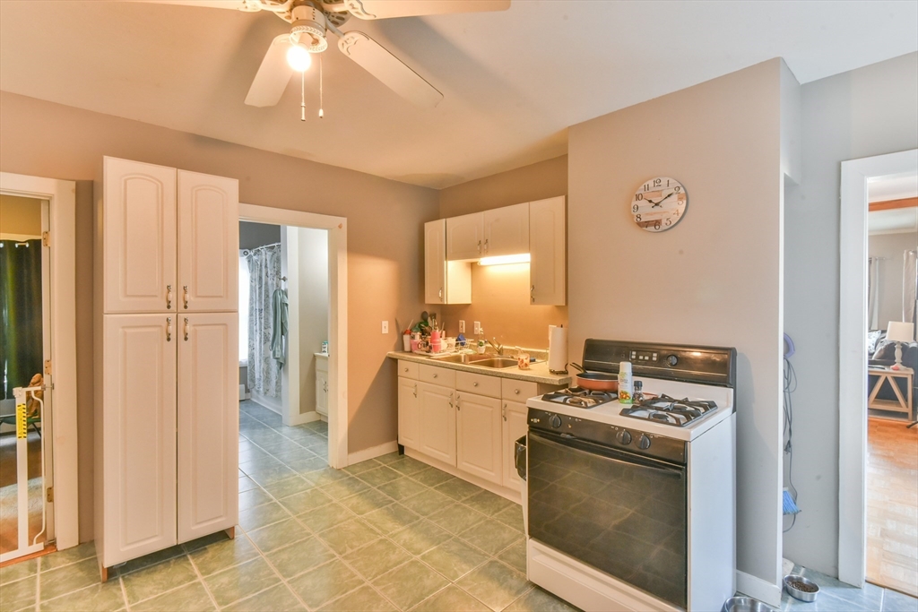 4 Agate Avenue Worcester, MA 01604 - Photo 26 of 39 a kitchen with stainless steel appliances granite countertop a stove and a refrigerator