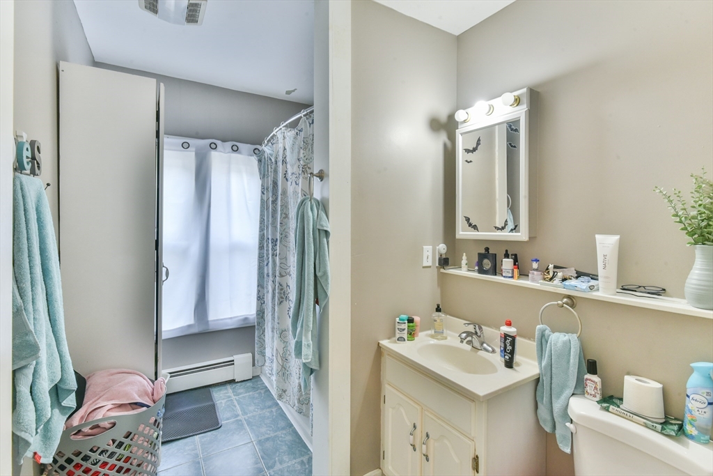 4 Agate Avenue Worcester, MA 01604 - Photo 28 of 39 a bathroom with a sink a toilet and a mirror
