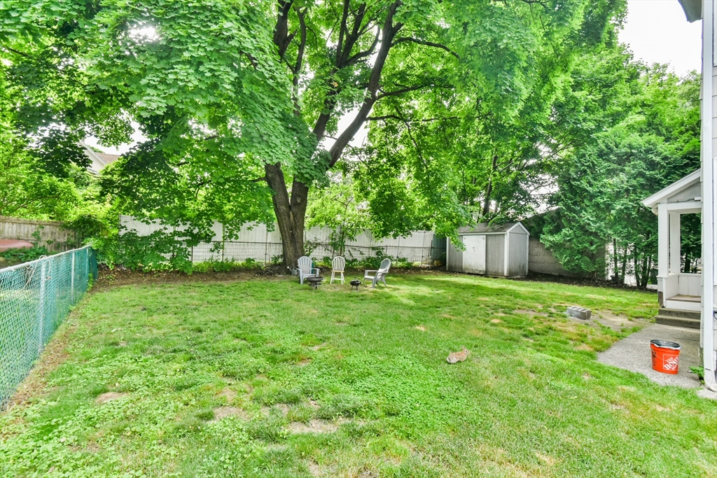 4 Agate Avenue Worcester, MA 01604 - Photo 3 of 39 a view of a backyard with a garden and trees