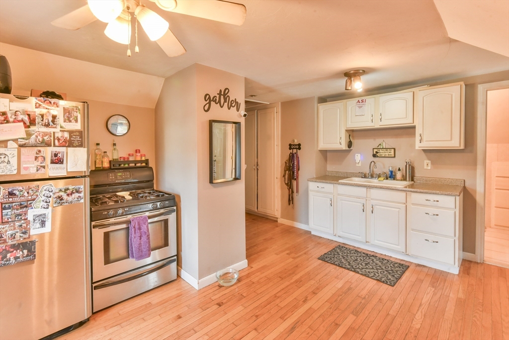 4 Agate Avenue Worcester, MA 01604 - Photo 31 of 39 a kitchen with stainless steel appliances granite countertop a refrigerator and a stove top oven