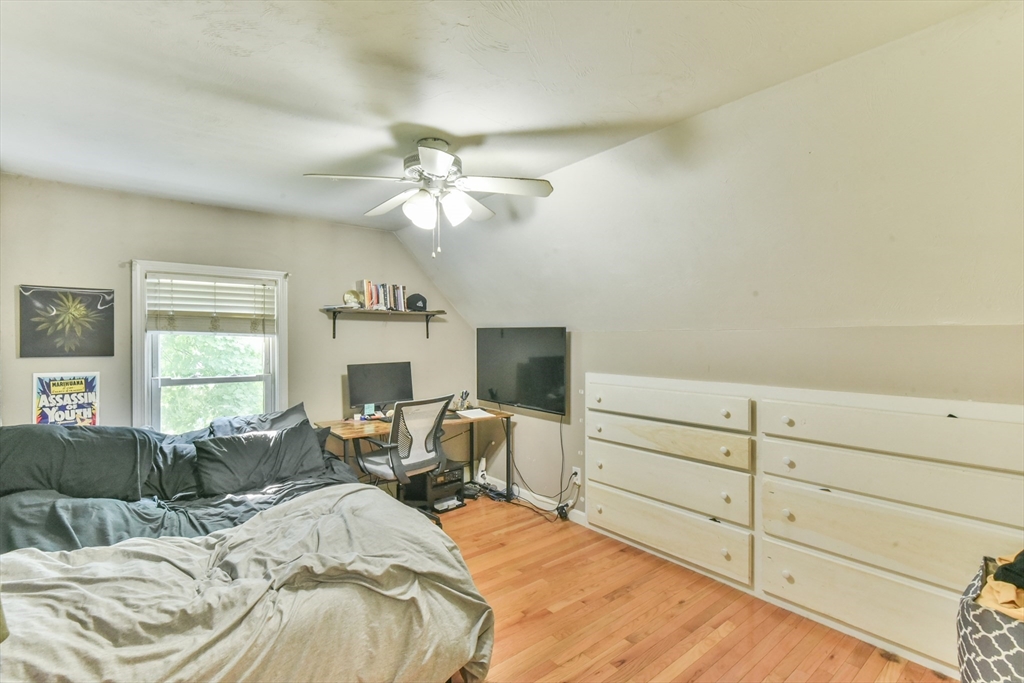 4 Agate Avenue Worcester, MA 01604 - Photo 34 of 39 a bed room with a bed mirror and a window