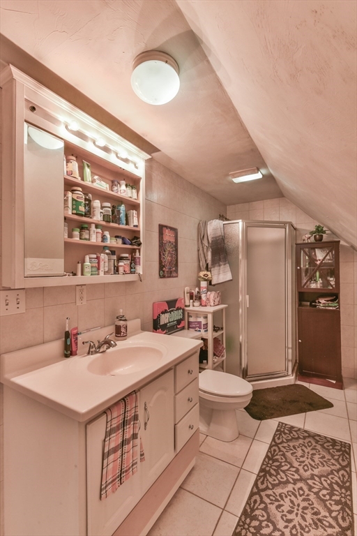 4 Agate Avenue Worcester, MA 01604 - Photo 36 of 39 a bathroom with a sink a toilet and shower