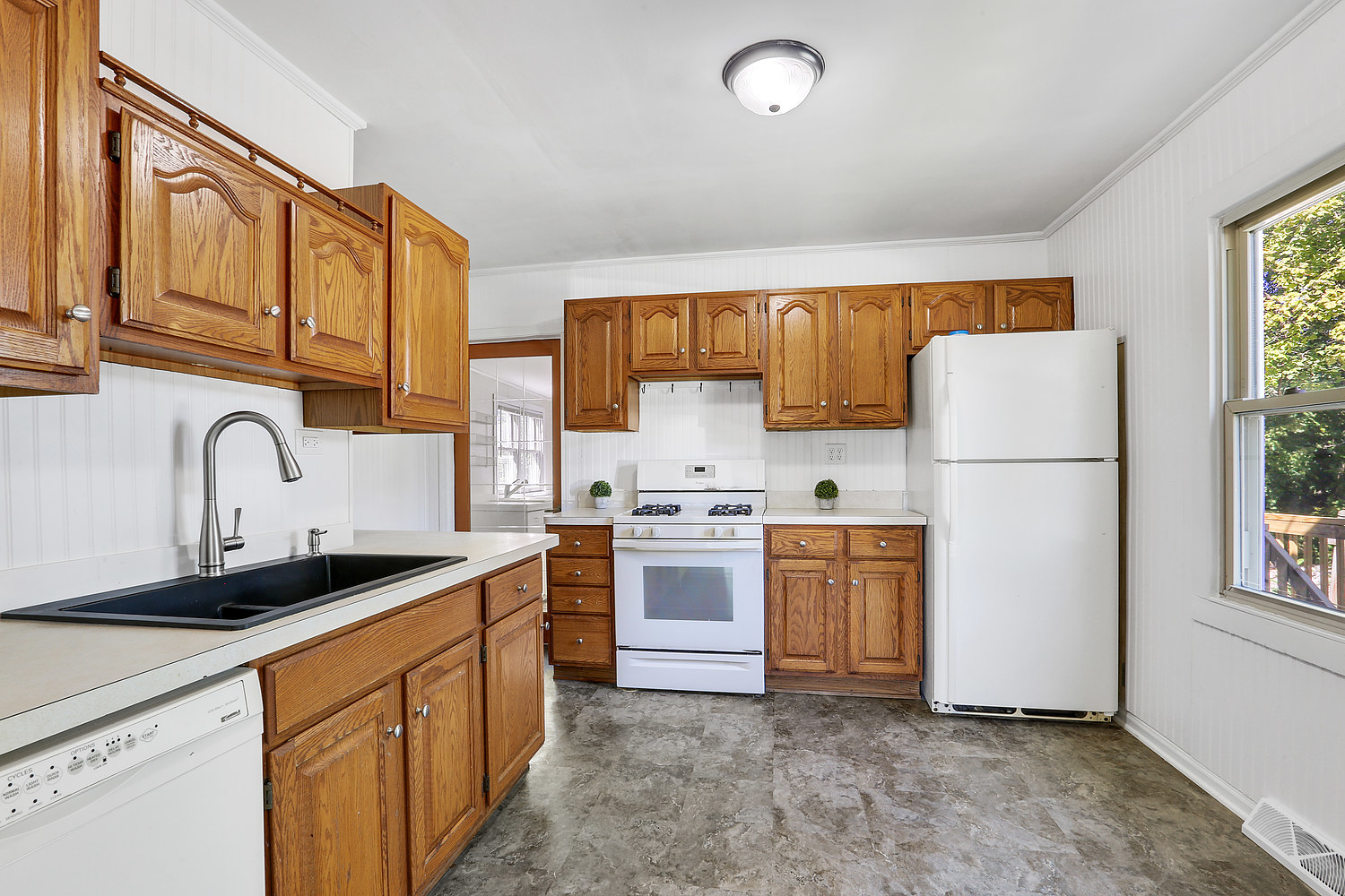 14602 Kenton Avenue Midlothian, IL 60445 - Photo 3 of 16 a kitchen with stainless steel appliances granite countertop a refrigerator a stove a sink and a microwave