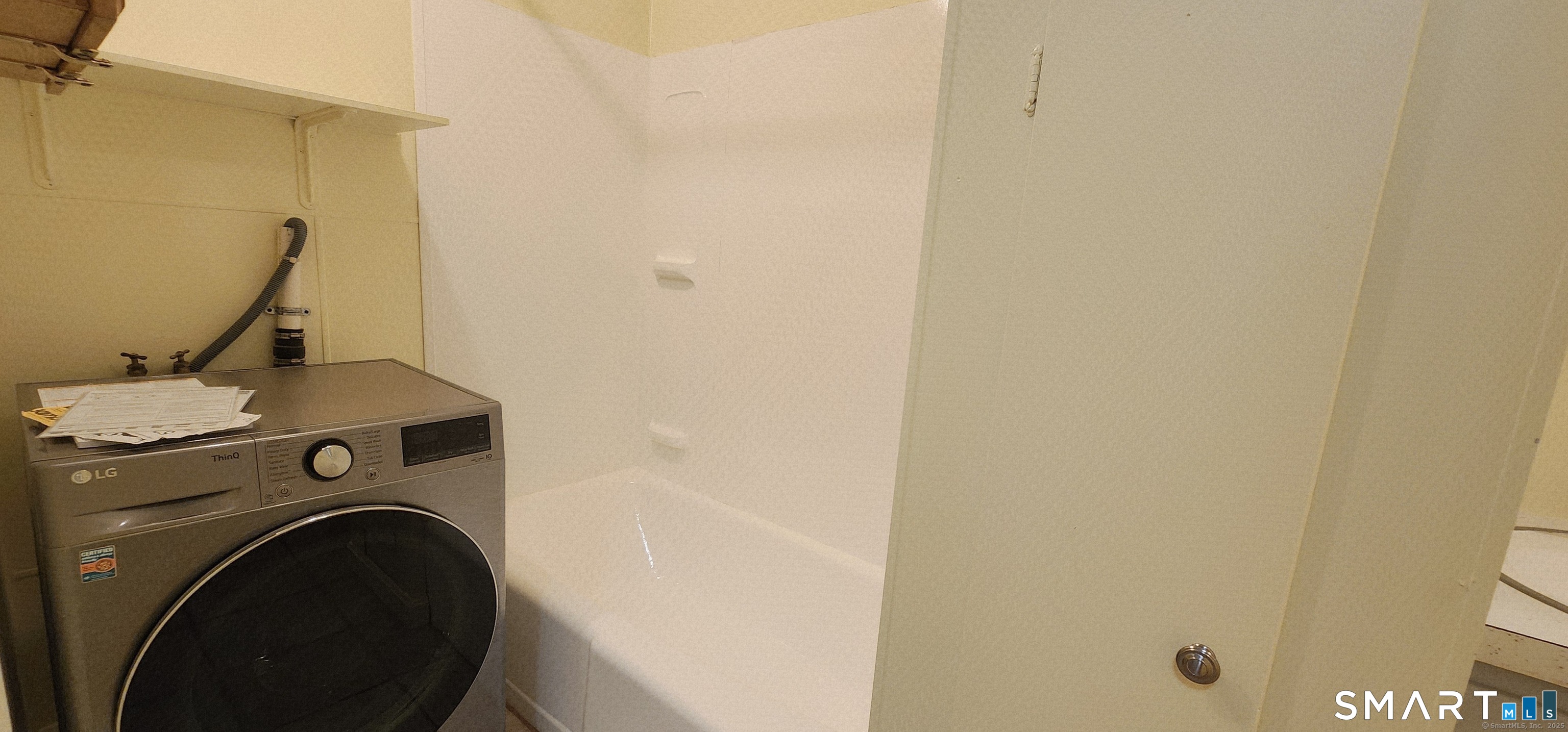 1267-unit B Thompson Road Thompson, CT 06277 - Photo 7 of 7 a utility room with dryer and washer