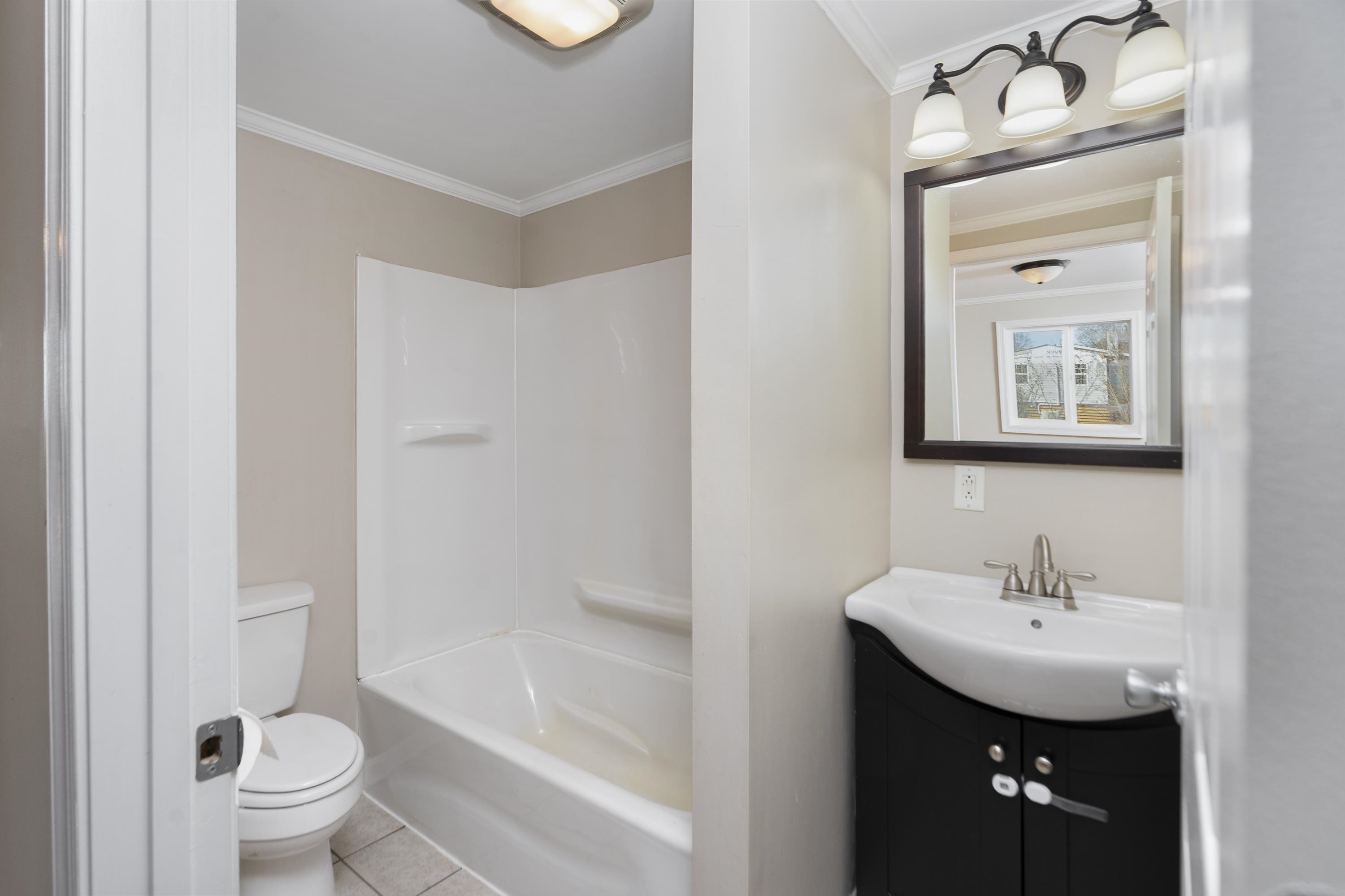 7081 Secretarys Sand Road Schuyler, VA 22969 - Photo 12 of 65 a bathroom with a sink toilet and shower