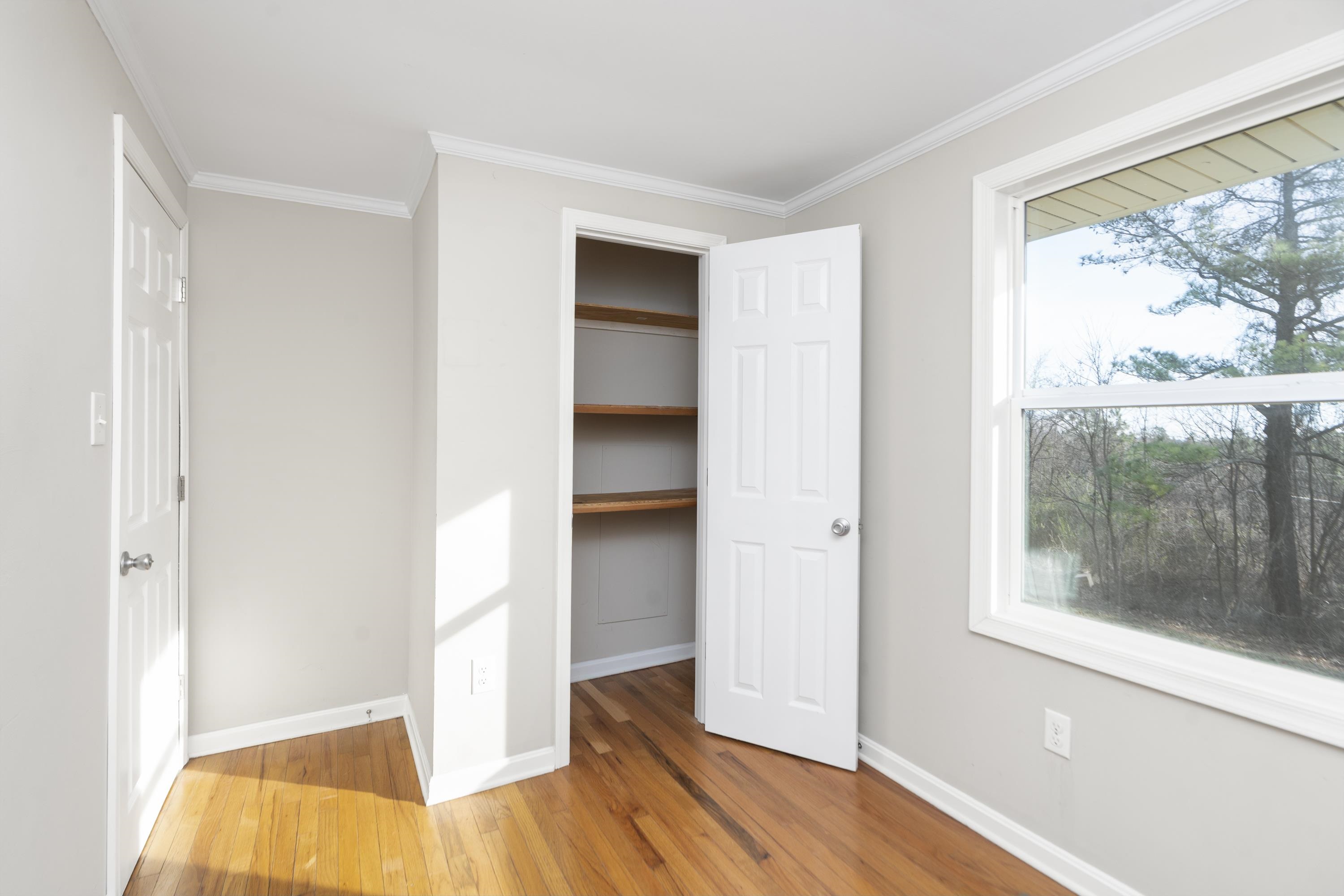 7081 Secretarys Sand Road Schuyler, VA 22969 - Photo 16 of 65 a view of hallway with a large window and wooden floor