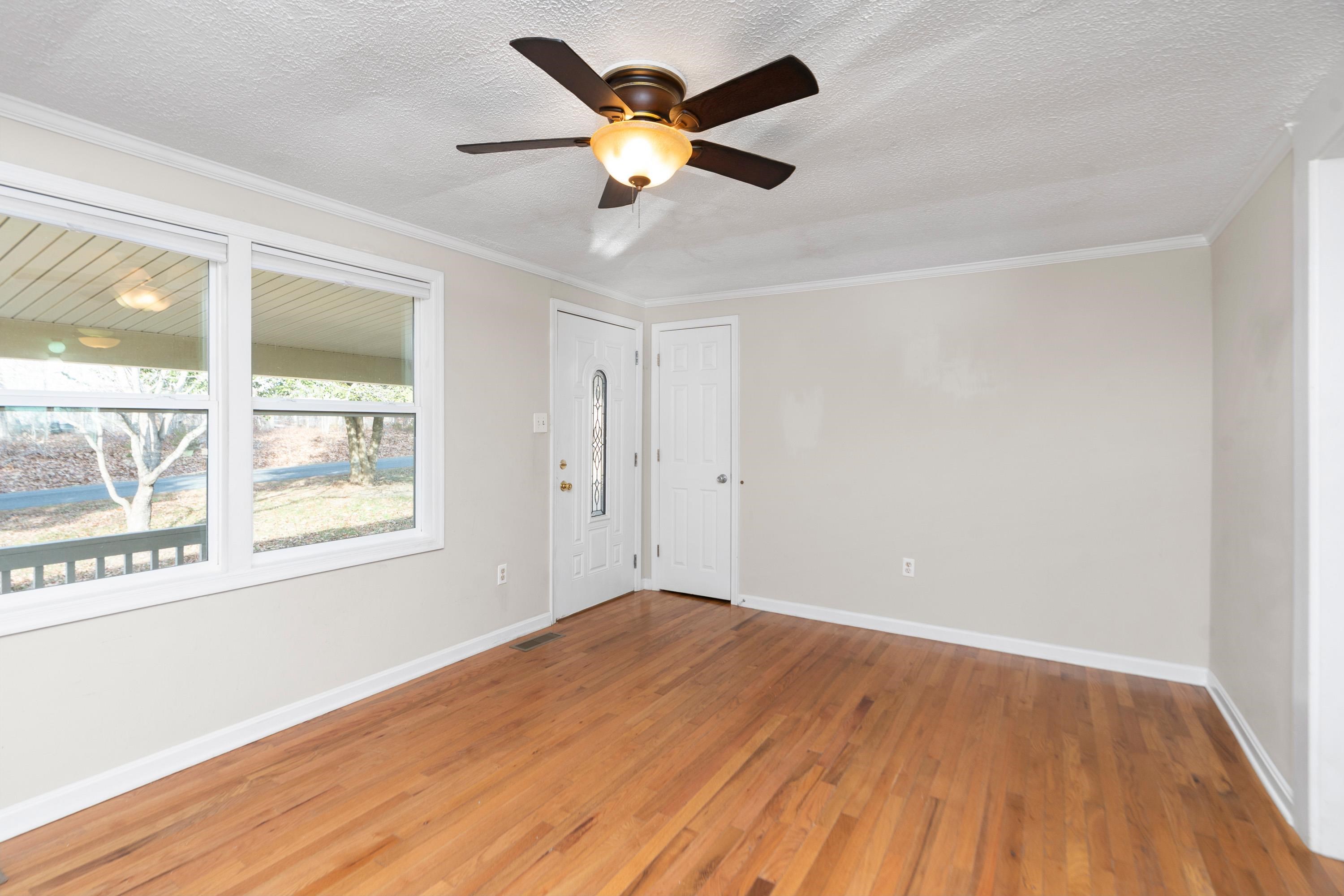 7081 Secretarys Sand Road Schuyler, VA 22969 - Photo 18 of 64 wooden floor in an empty room with a window