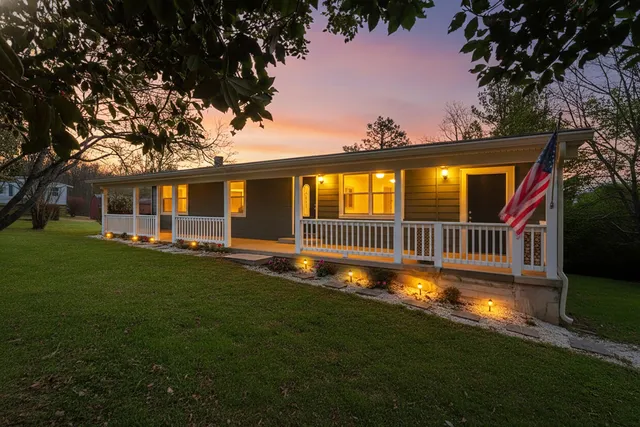 a kitchen with a refrigerator and a stove top oven