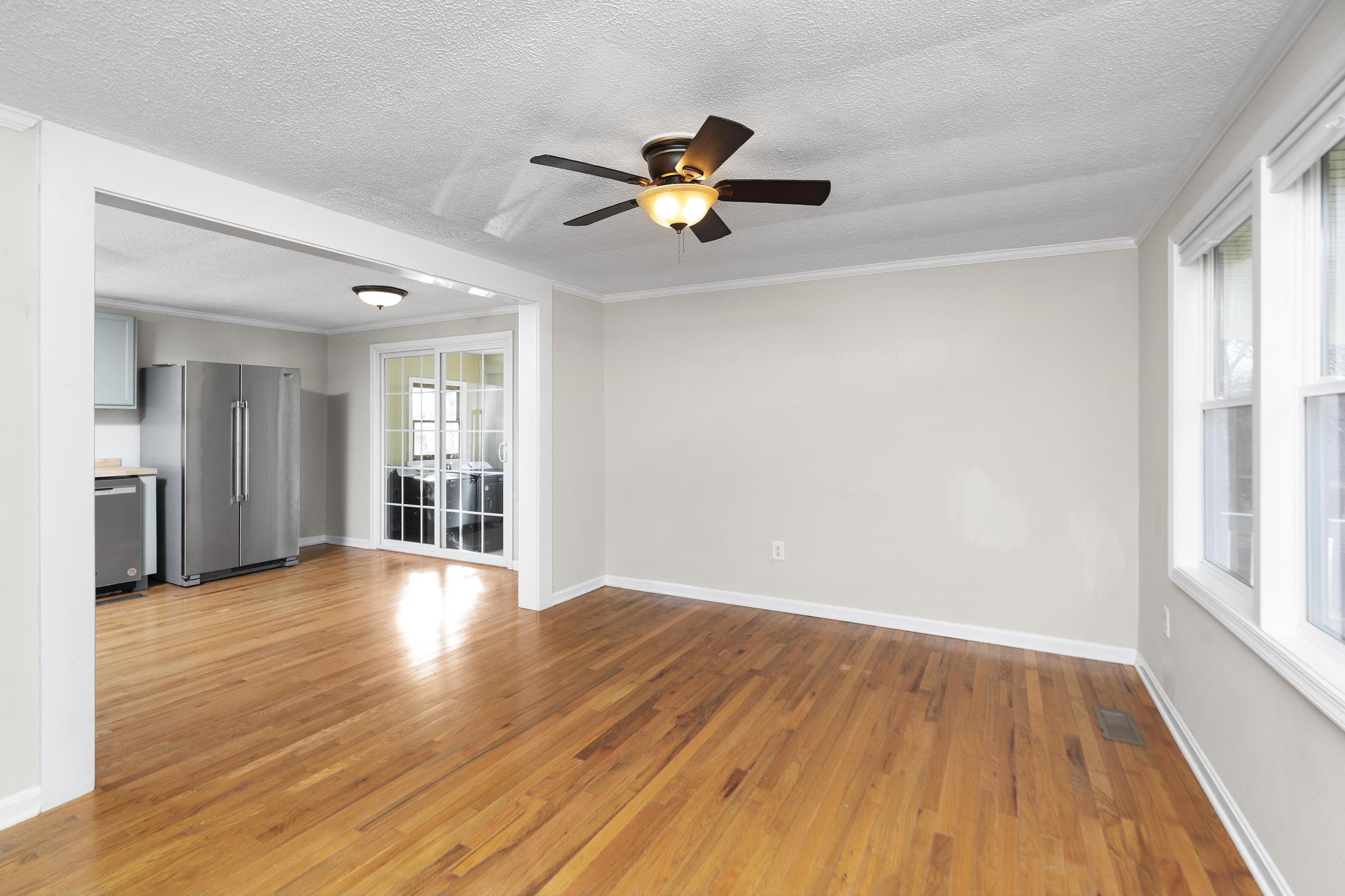 7081 Secretarys Sand Road Schuyler, VA 22969 - Photo 21 of 65 a view of empty room with wooden floor and fan