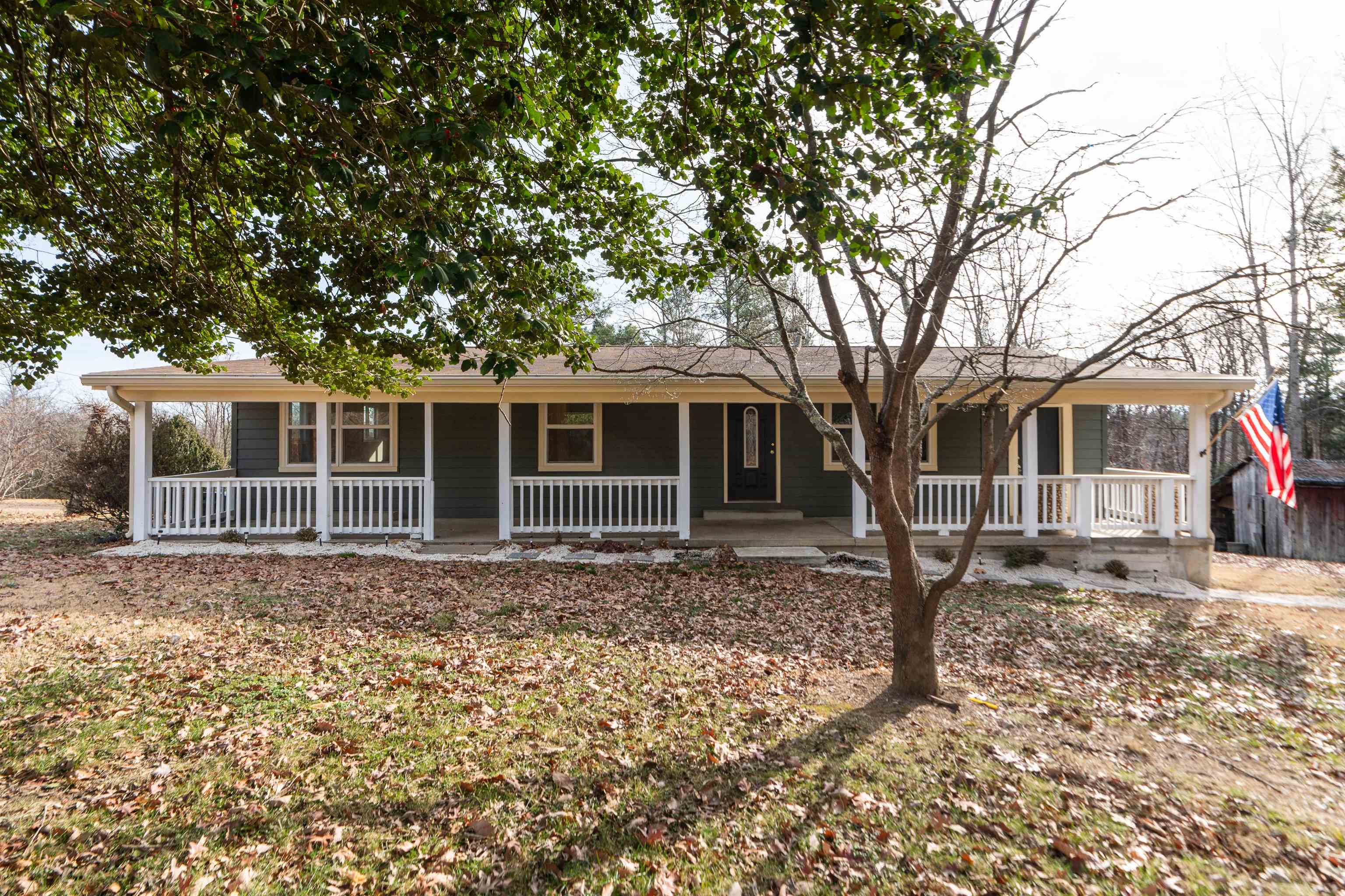 7081 Secretarys Sand Road Schuyler, VA 22969 - Photo 22 of 64 a front view of a house with a garden