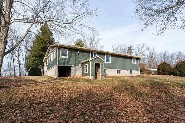 a backyard of a house with wooden deck and deck