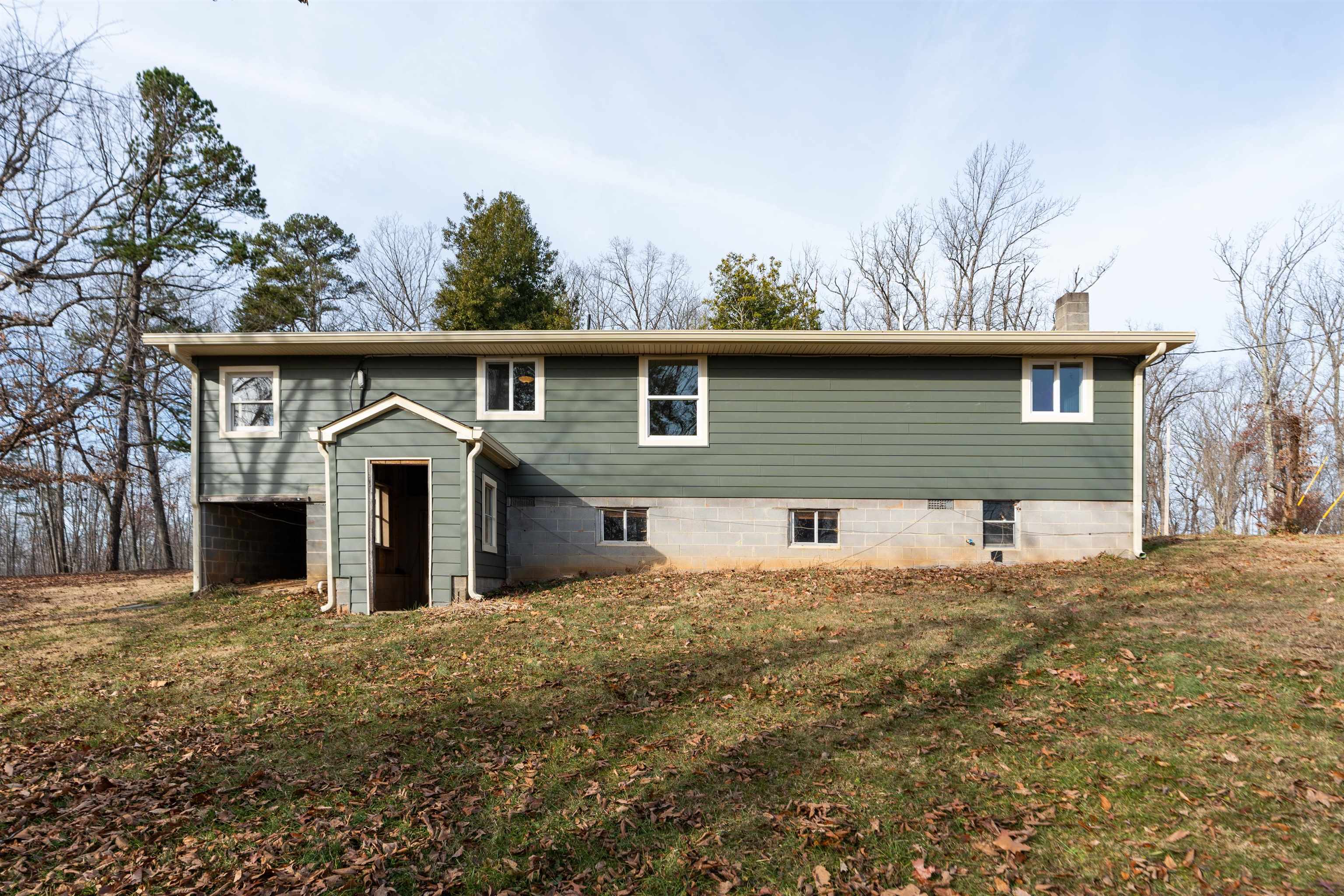 7081 Secretarys Sand Road Schuyler, VA 22969 - Photo 26 of 64 a front view of house with yard and trees in the background