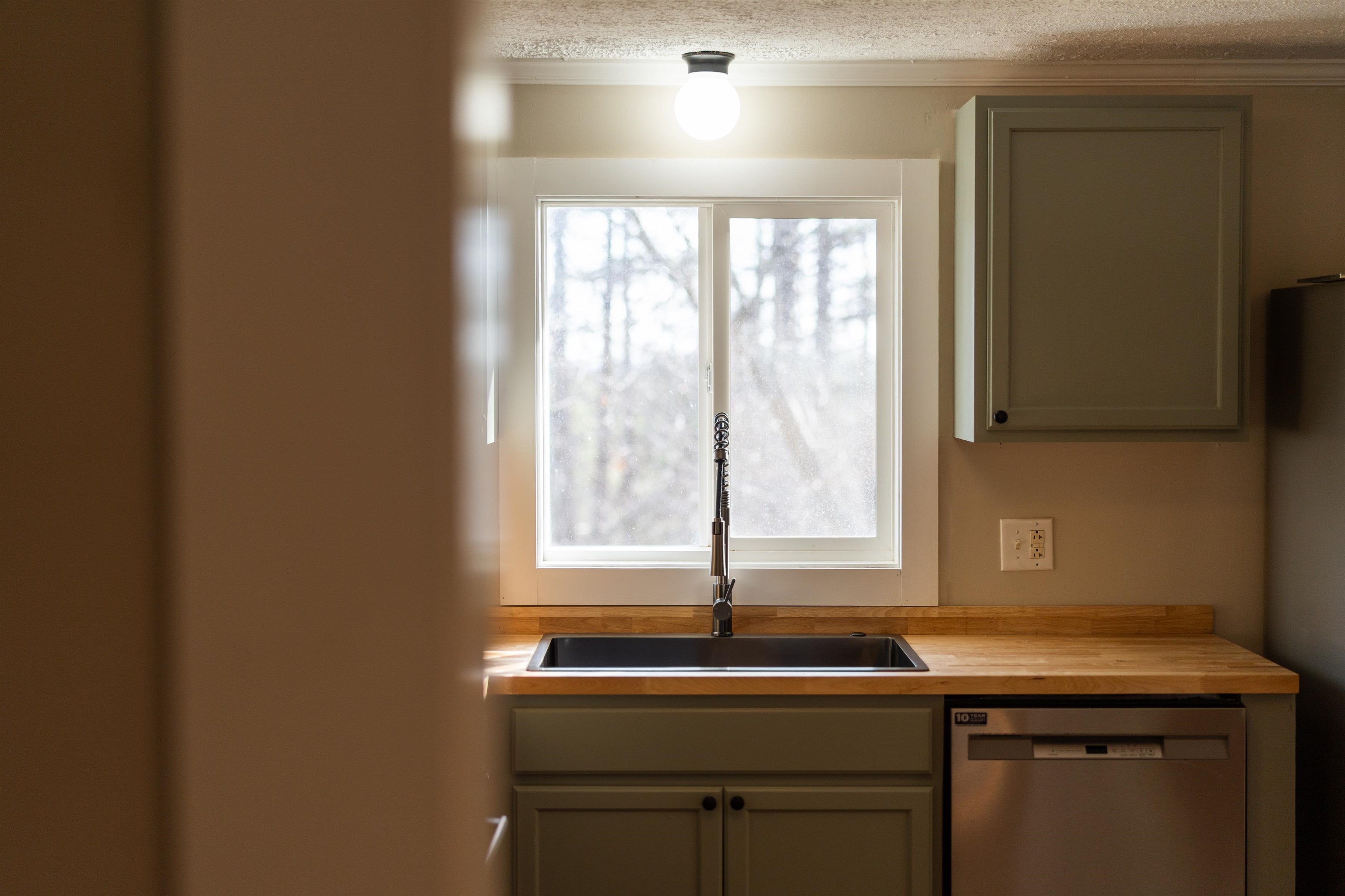 7081 Secretarys Sand Road Schuyler, VA 22969 - Photo 59 of 65 a view of a sink with a microwave and a sink