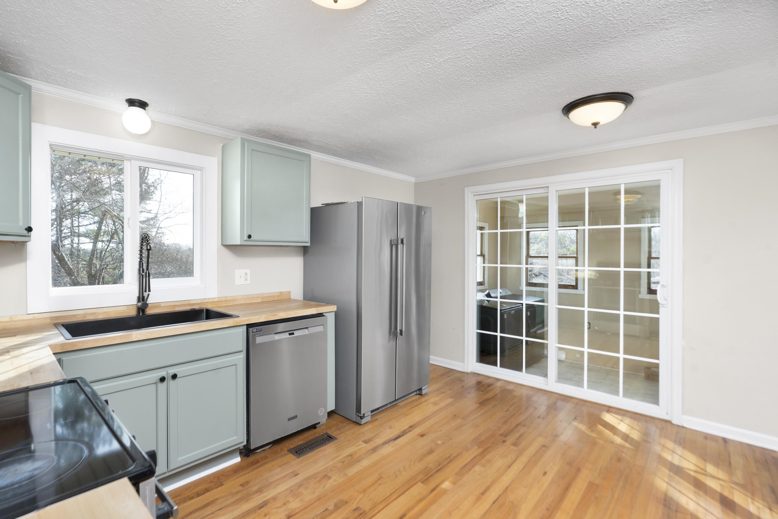 7081 Secretarys Sand Road Schuyler, VA 22969 - Photo 6 of 65 a kitchen with a sink stove and refrigerator